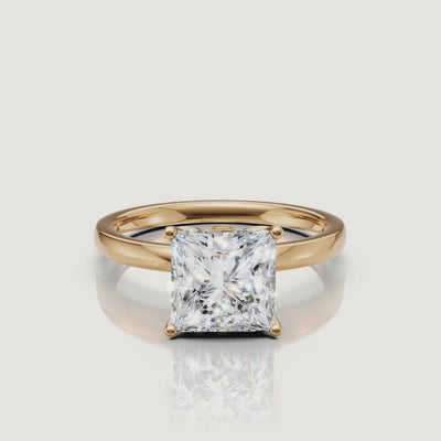 High-definition product video of a Raul Diamonds princess cut solitaire ring in yellow gold, showcasing the intense sparkle and classic architectural setting