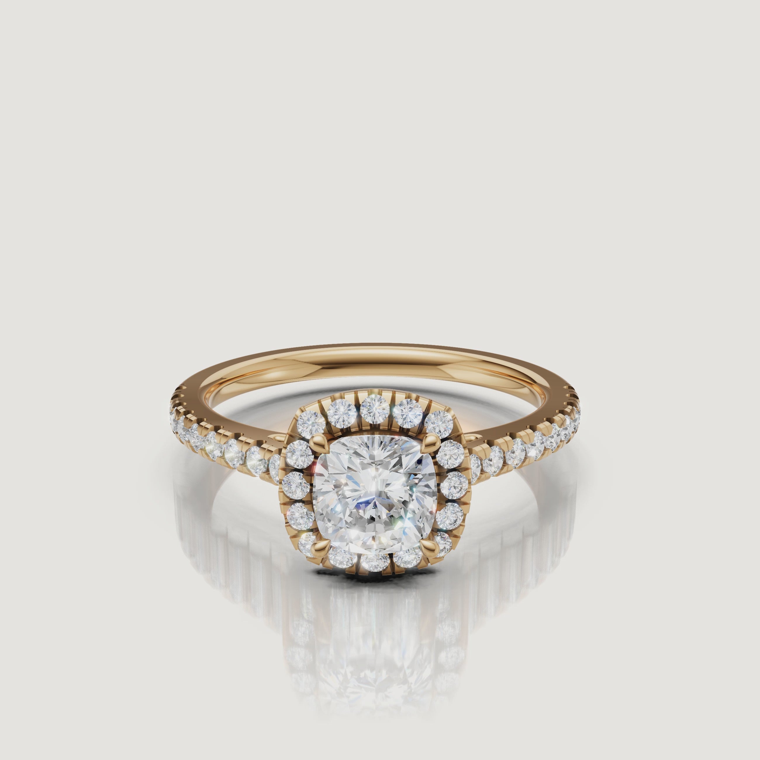 video of cushion cut lab grown diamond halo engagement ring with pavé band in 14k yellow gold