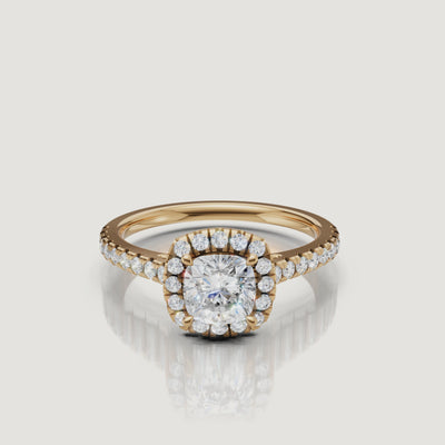 video of cushion cut lab grown diamond halo engagement ring with pavé band in 14k yellow gold