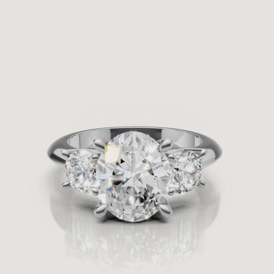 High-definition video of the Raul Diamonds white gold oval three-stone engagement ring, demonstrating the seamless brilliance and modern elegance of the trilogy setting.