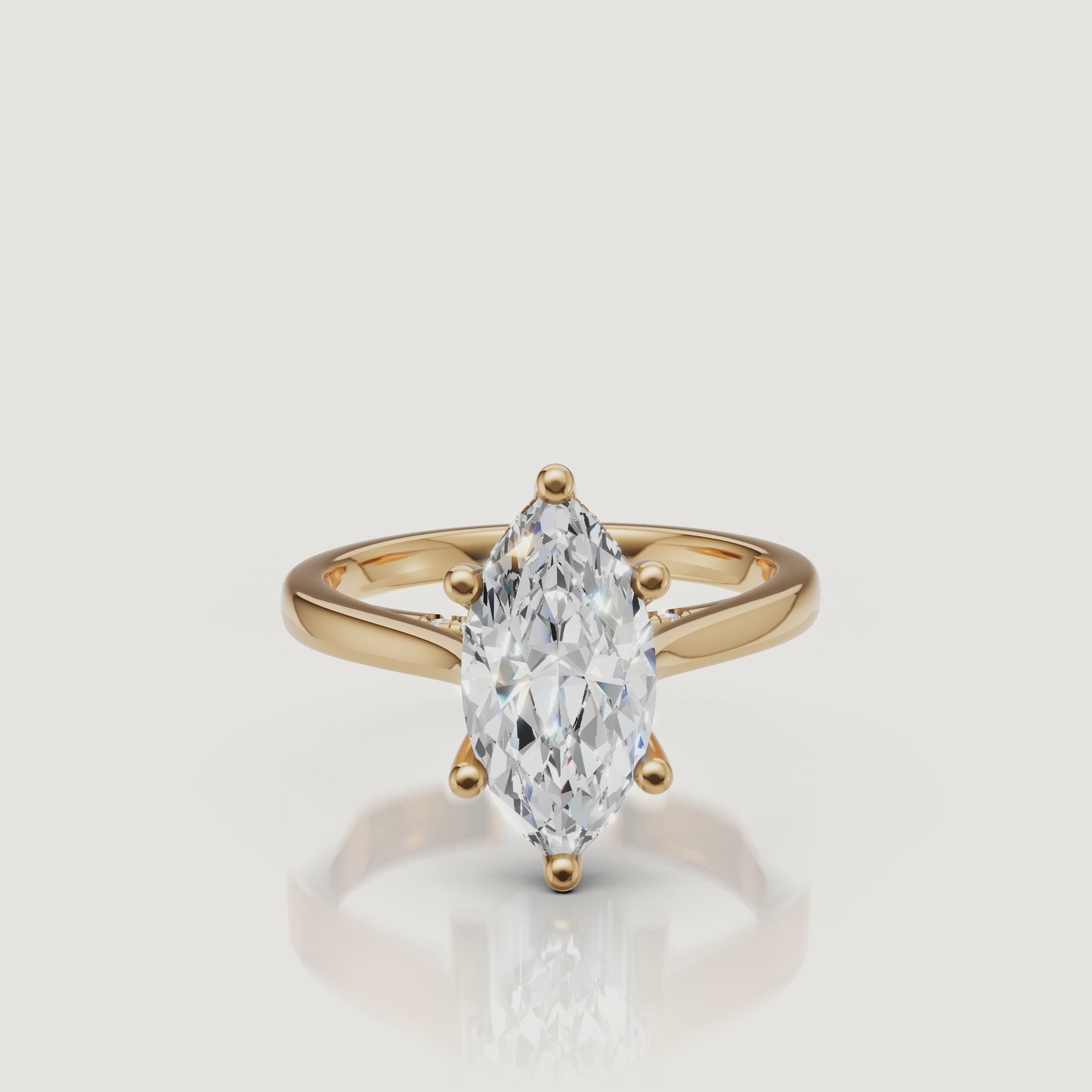 HD cinematic video showing the light performance of a Raul Diamonds marquise cut engagement ring in 18k yellow gold