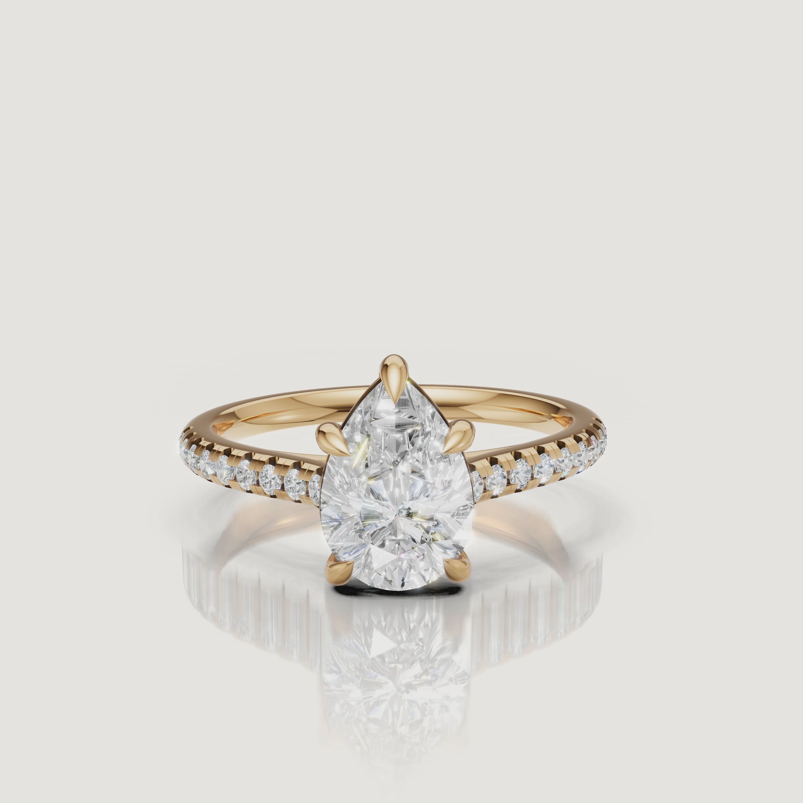 Yellow gold pear cut diamond engagement ring video by Raul Diamonds with pavé diamond band sparkle