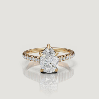 Yellow gold pear cut diamond engagement ring video by Raul Diamonds with pavé diamond band sparkle