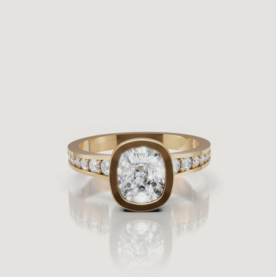 360 video of the Seo yellow gold bezel cushion diamond engagement ring with pavé band by Raul Diamonds.