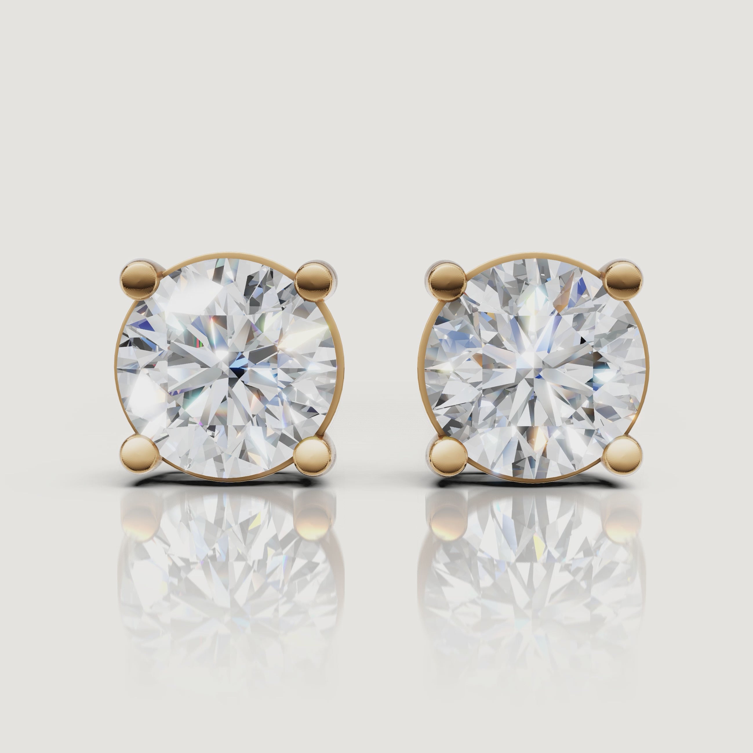 Yellow gold round diamond stud earrings video showcasing brilliant solitaire sparkle by Raul Diamonds
