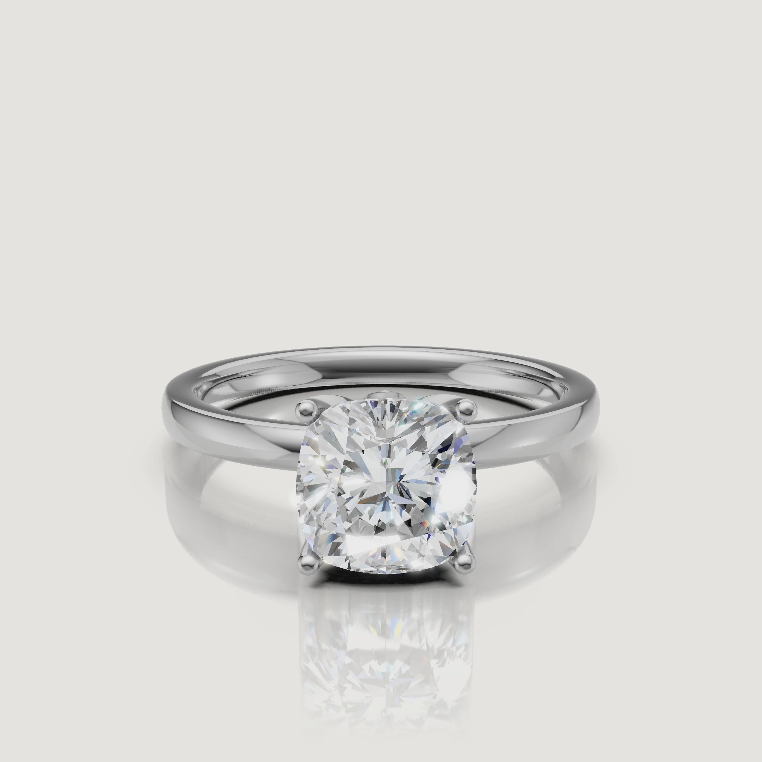 High-clarity video of a white gold cushion cut solitaire engagement ring from Raul Diamonds, featuring a 360-degree view of the brilliant-cut stone and four-prong setting