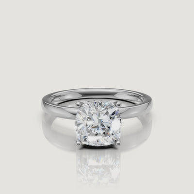 High-clarity video of a white gold cushion cut solitaire engagement ring from Raul Diamonds, featuring a 360-degree view of the brilliant-cut stone and four-prong setting