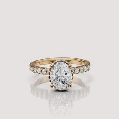 luxurious oval cut lab grown diamond engagement ring rotating video in 14k gold with hidden halo and pavé diamond band sparkling from every angle