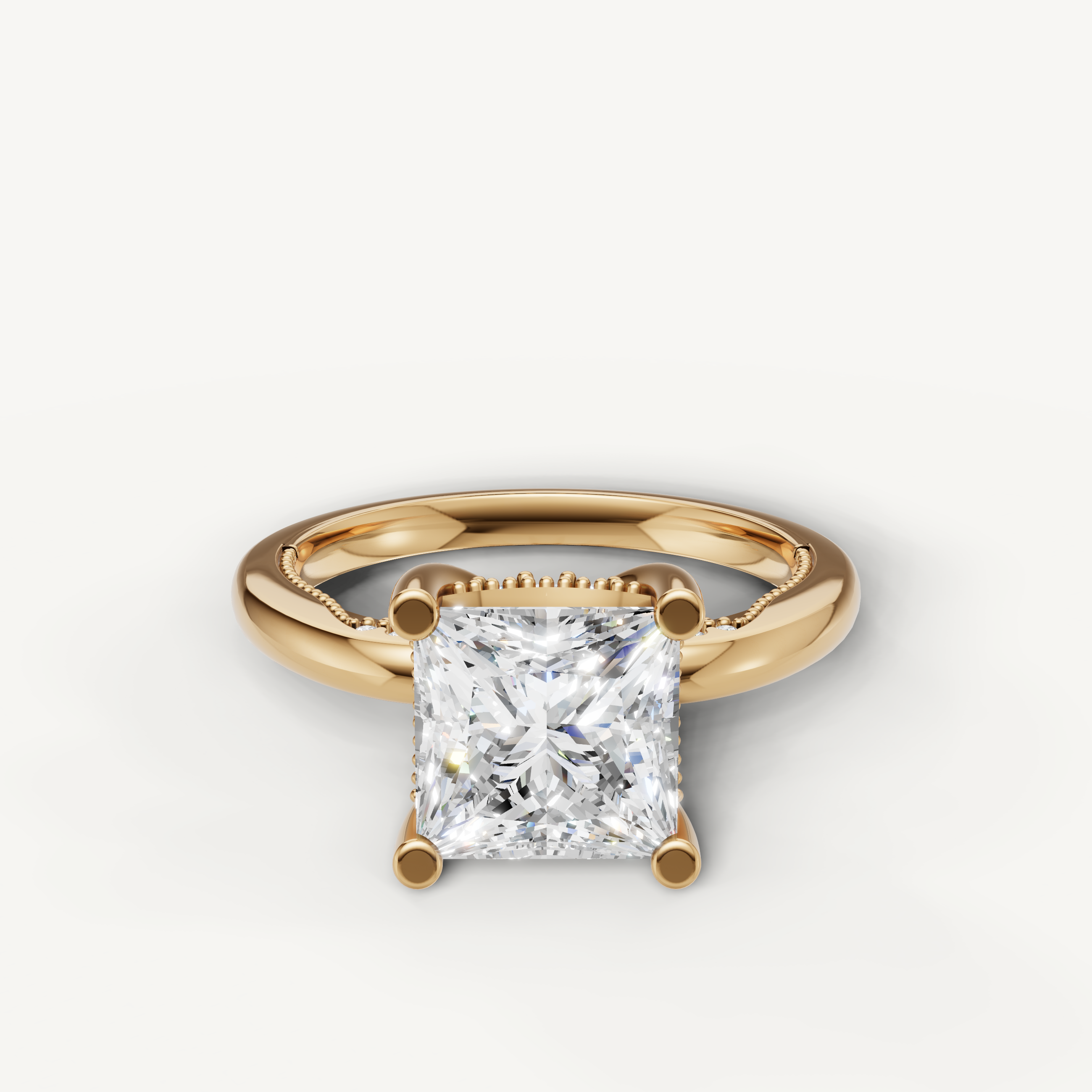 A classic solitaire engagement ring in polished 14k yellow gold, featuring a brilliant princess-cut diamond in a secure four-prong setting.