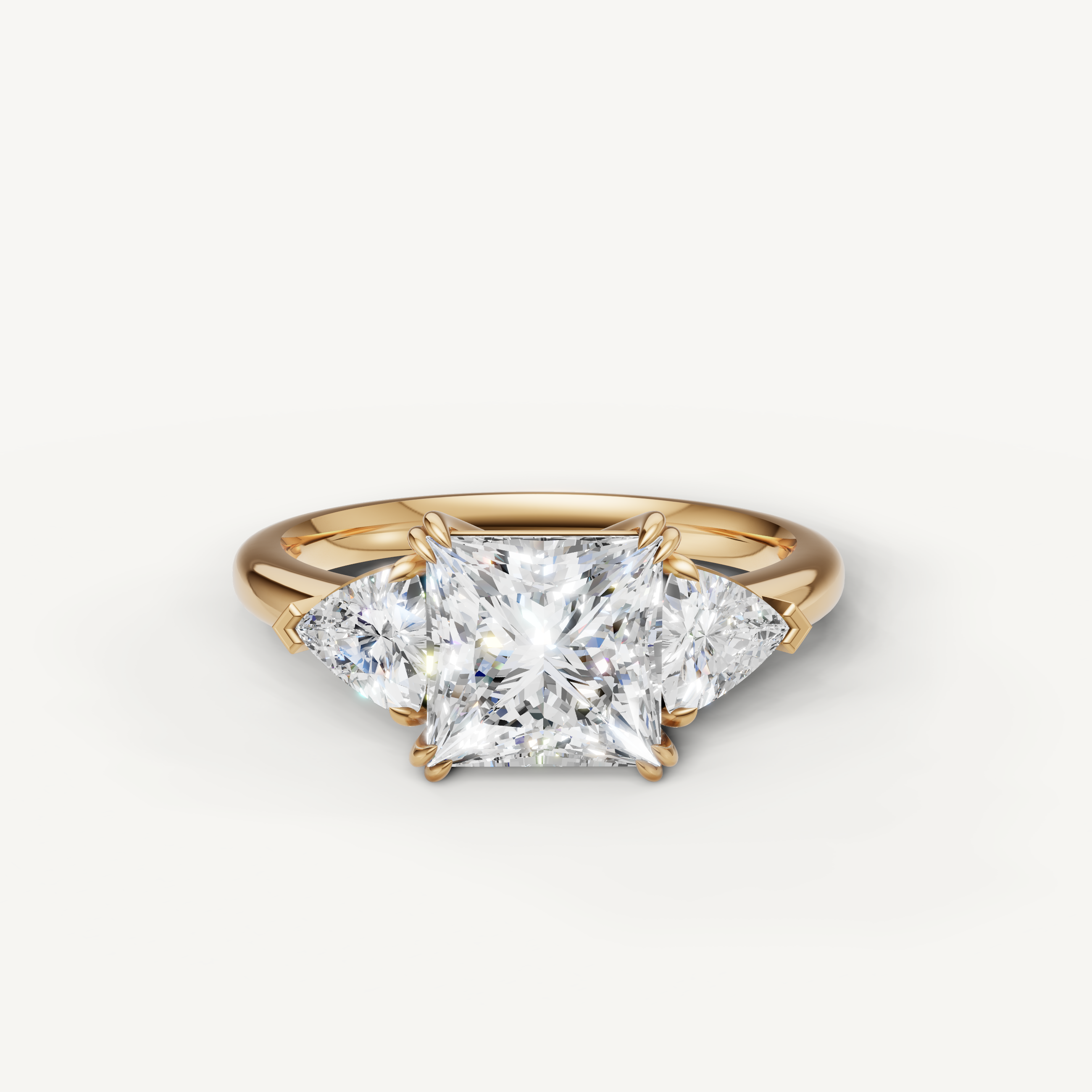 princess cut lab grown diamond engagement ring with trillion side stones in 14k yellow gold
