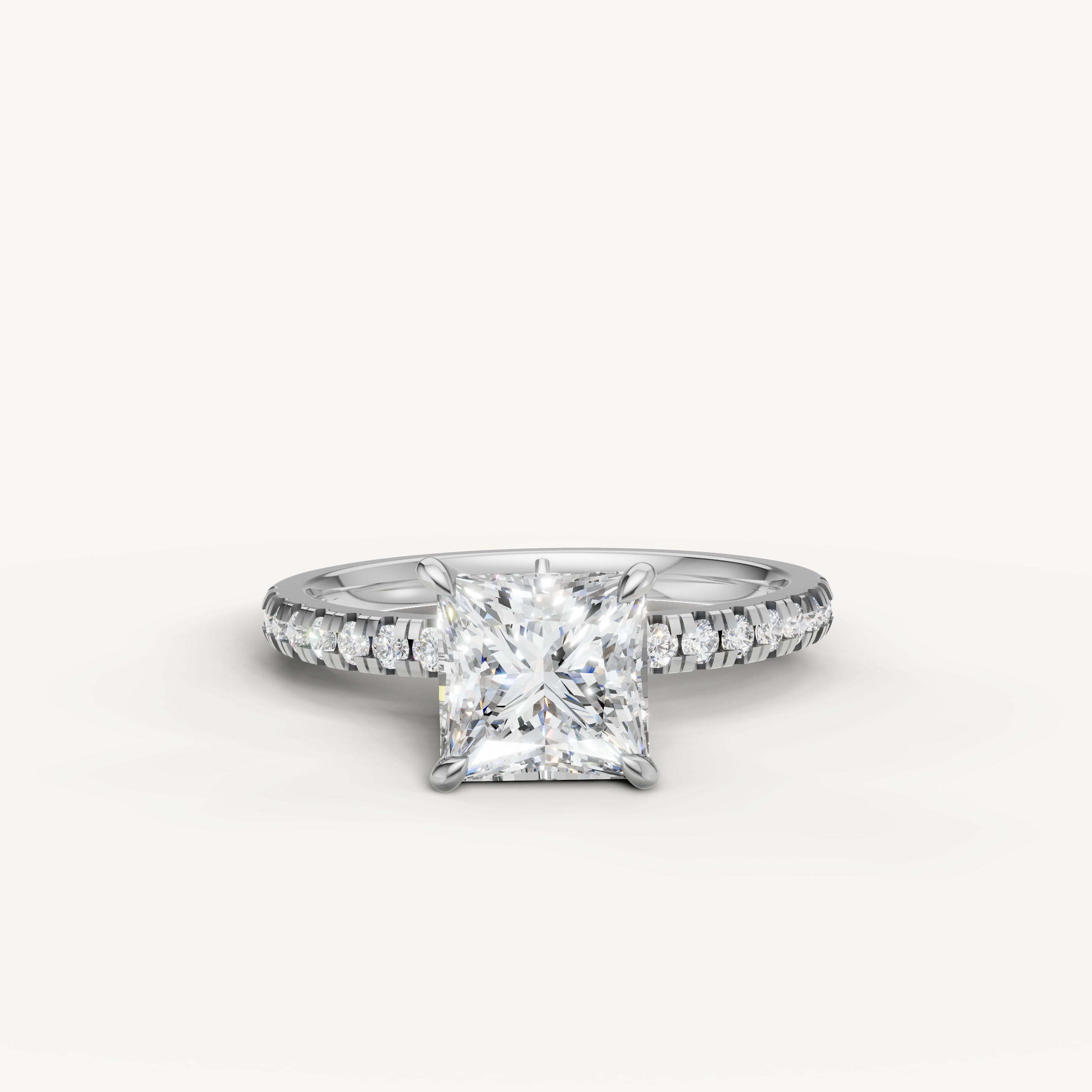 Raul Diamonds white gold princess cut engagement ring with a high-clarity center stone and a luxury pavé diamond band.