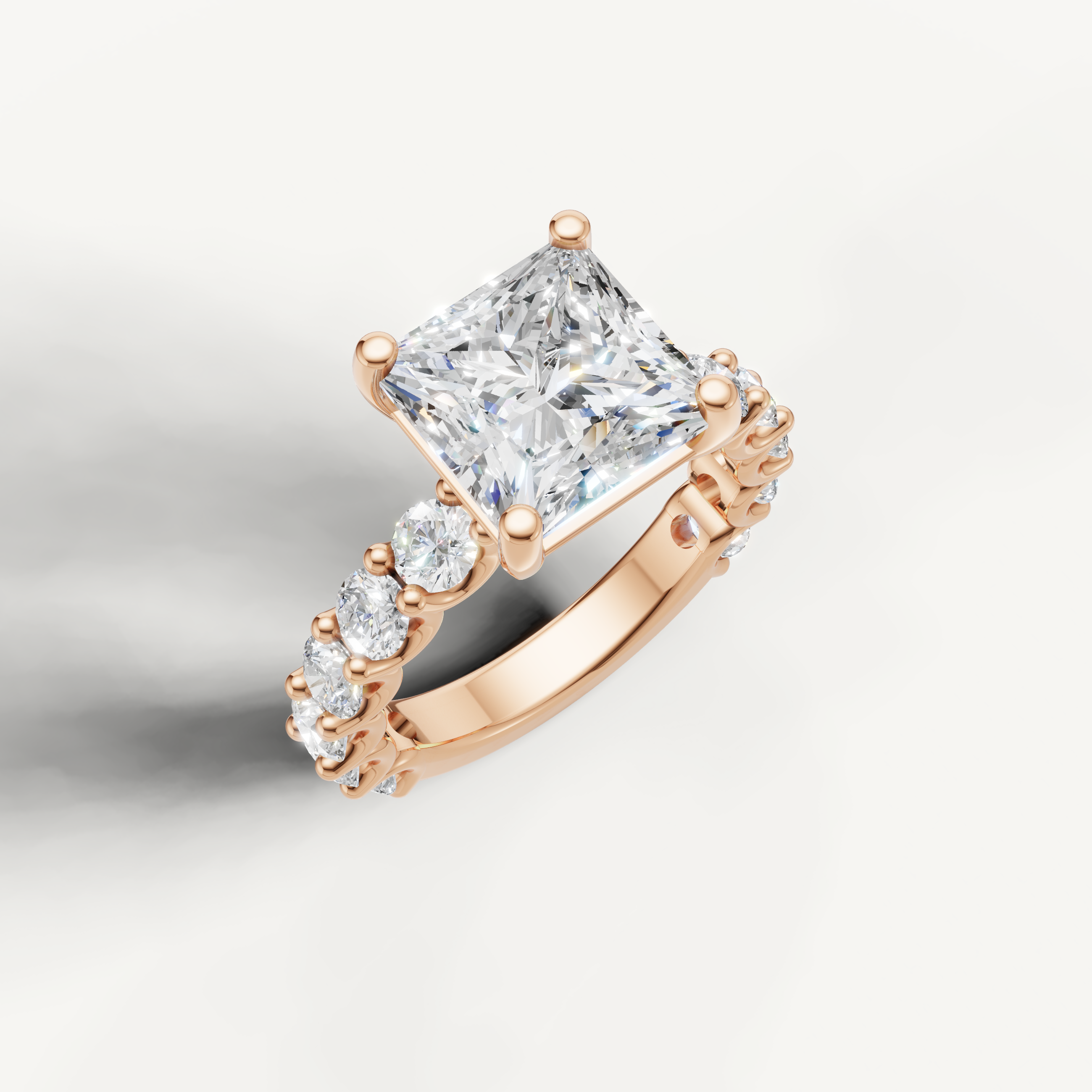 IGI certified princess cut lab diamond ring with round side diamonds shared prong band rose gold