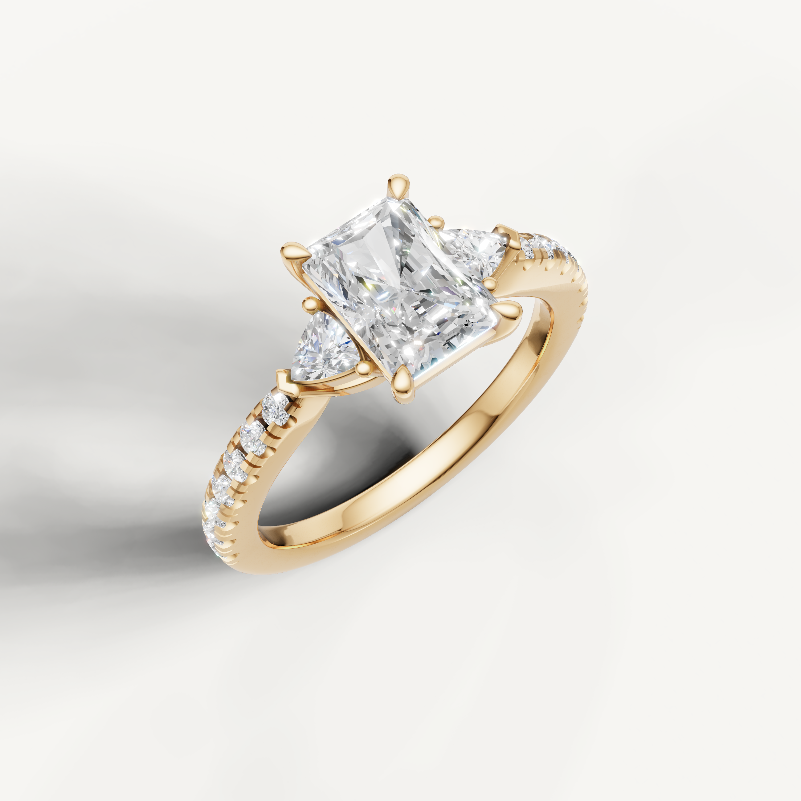 14K yellow gold radiant cut lab grown diamond ring with tapered side diamonds and pavé setting