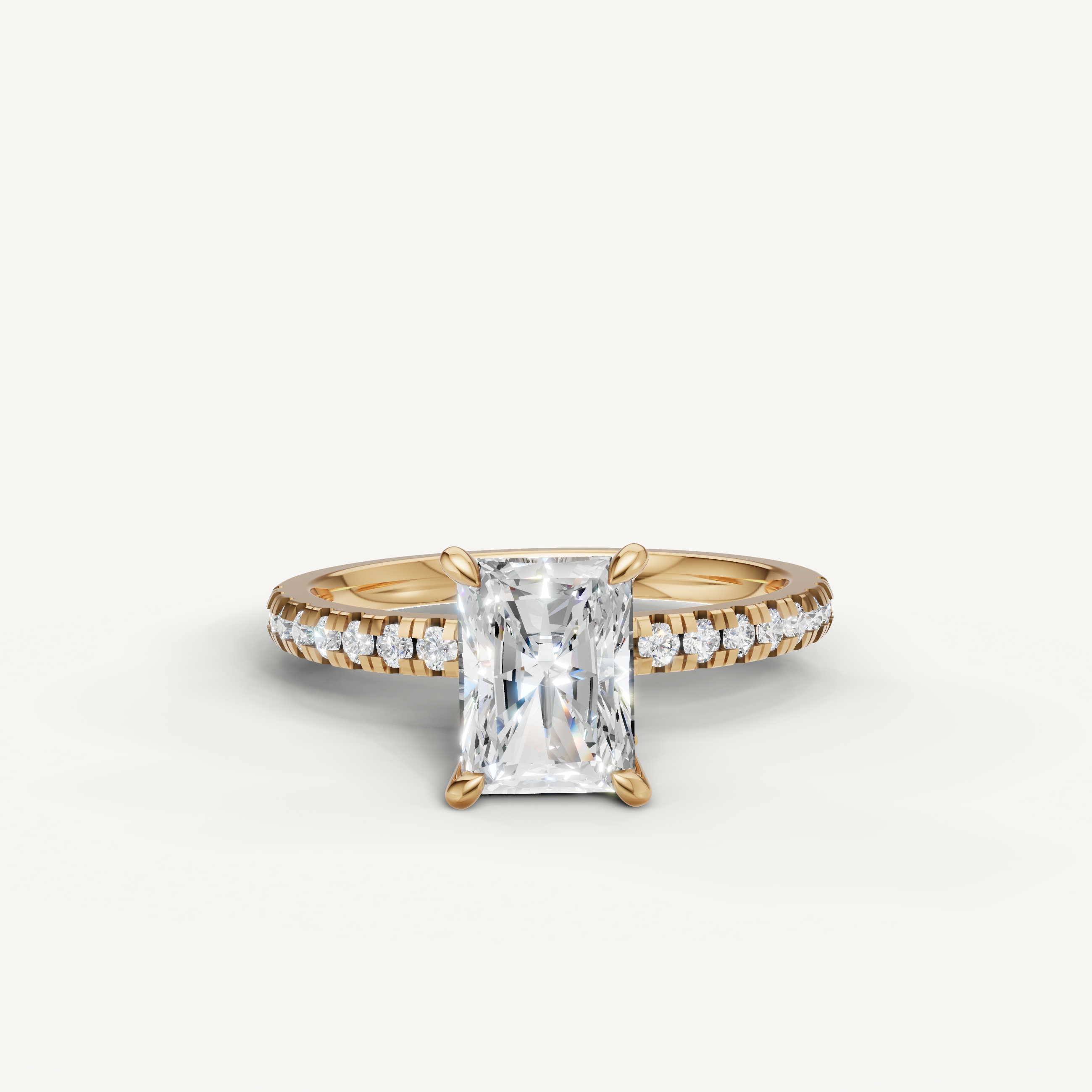 Raul Diamonds radiant cut engagement ring in 18k yellow gold featuring a brilliant center stone and pavé diamond band.