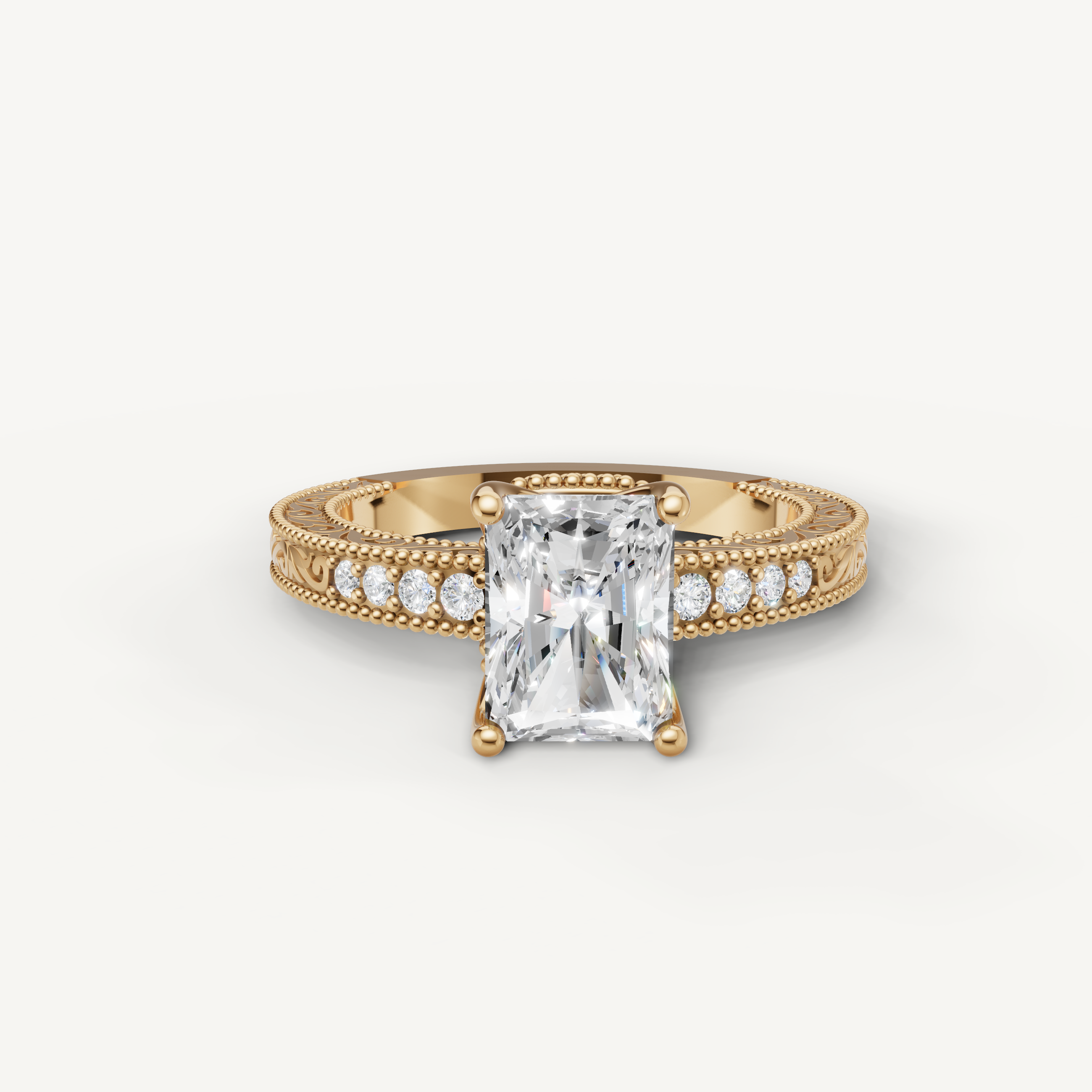 Vintage radiant cut lab grown diamond engagement ring in 14K yellow gold with intricate filigree and pavé detailing by Raul Diamonds.