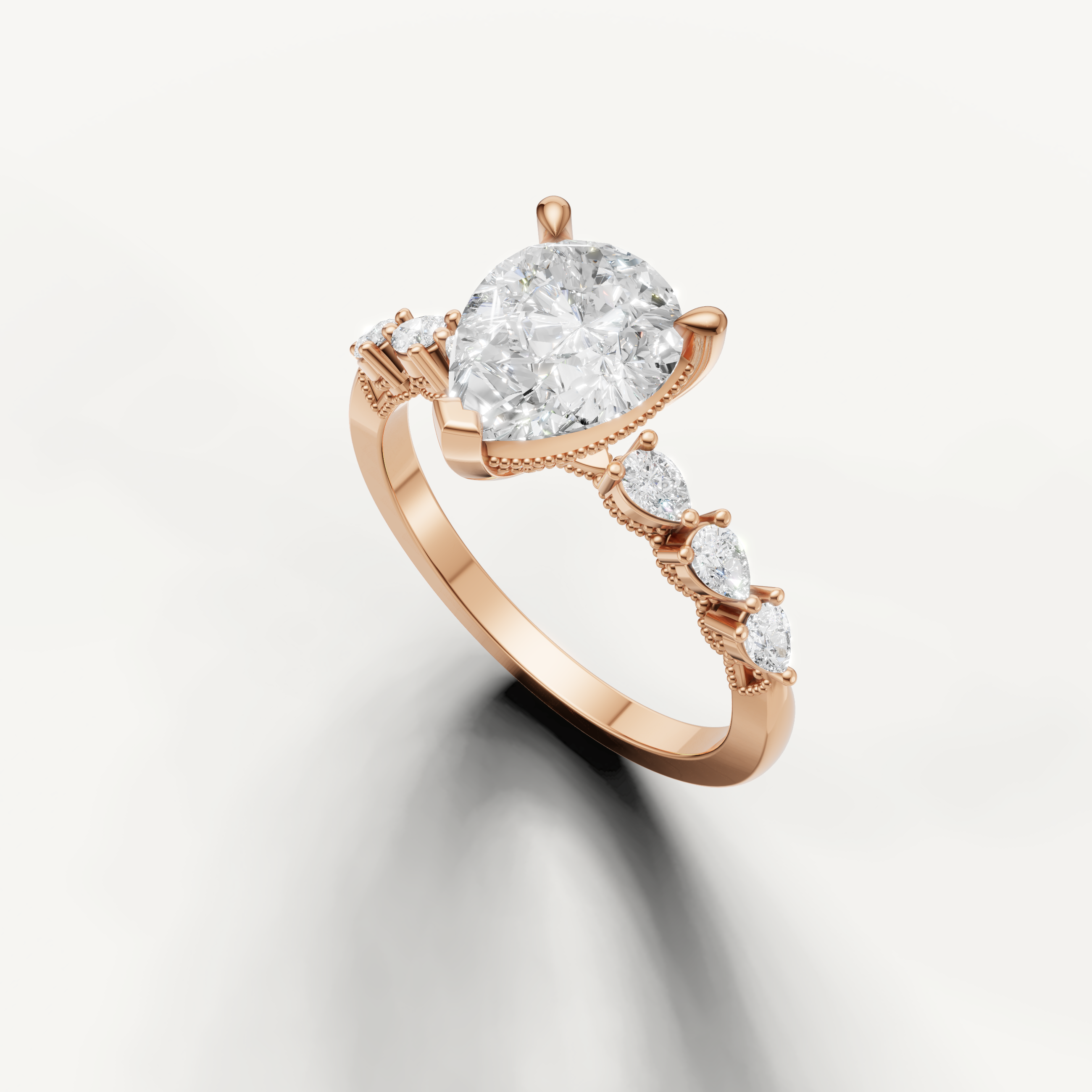 14K rose gold pear cut engagement ring featuring lab grown diamond center stone and marquise side diamonds