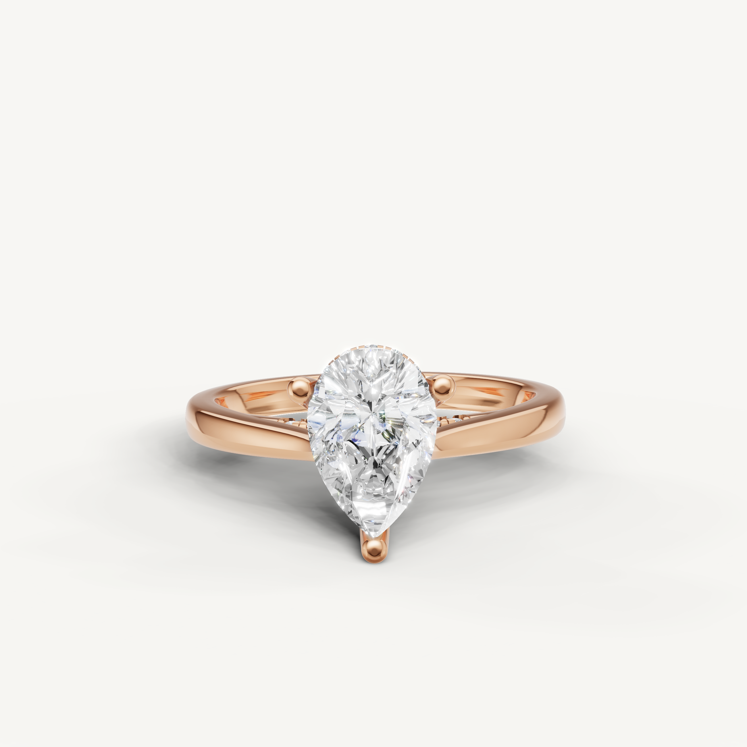 14K rose gold pear-shaped lab-grown diamond engagement ring with hidden halo design