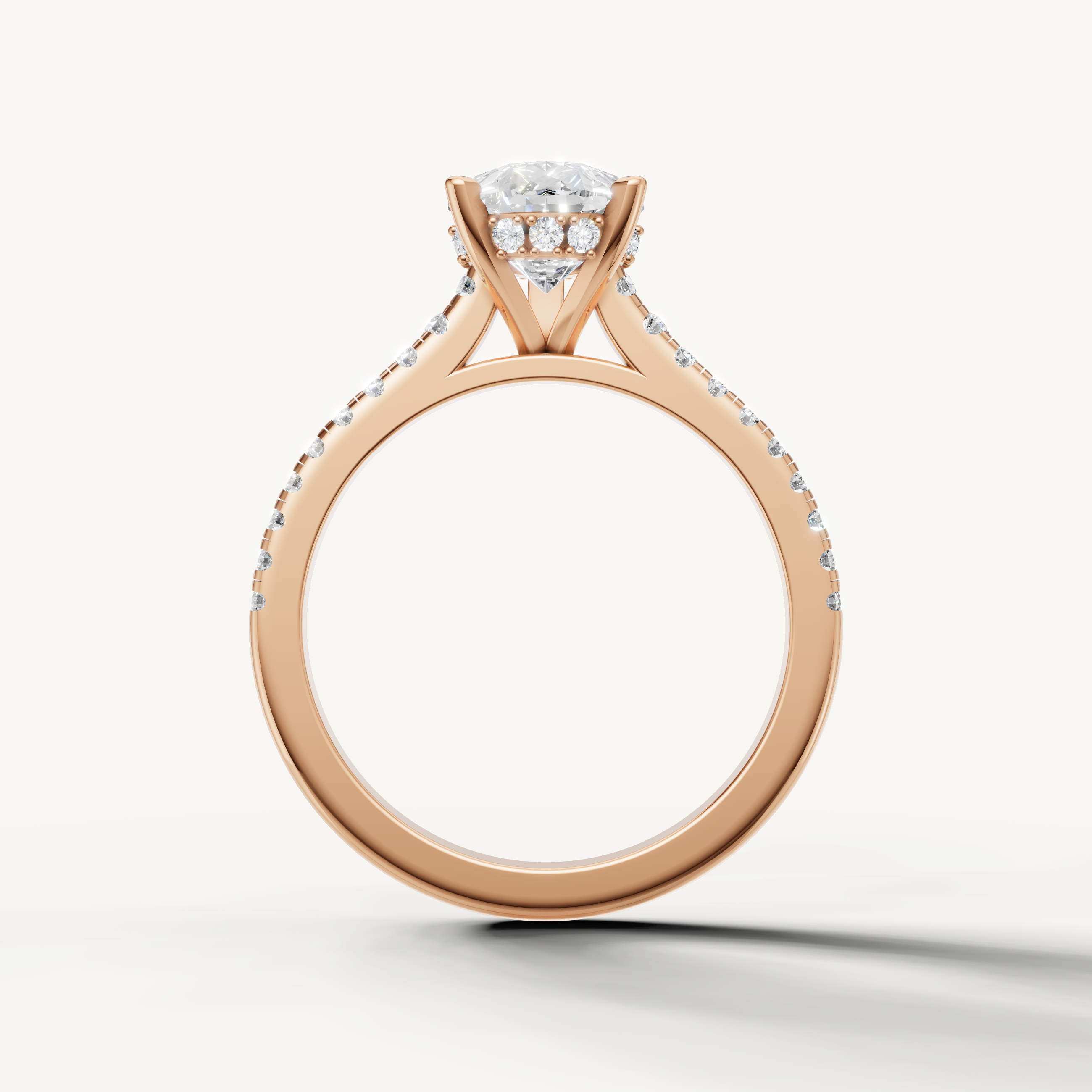 Modern pear cut lab grown diamond ring in polished rose gold with refined pavé detailing