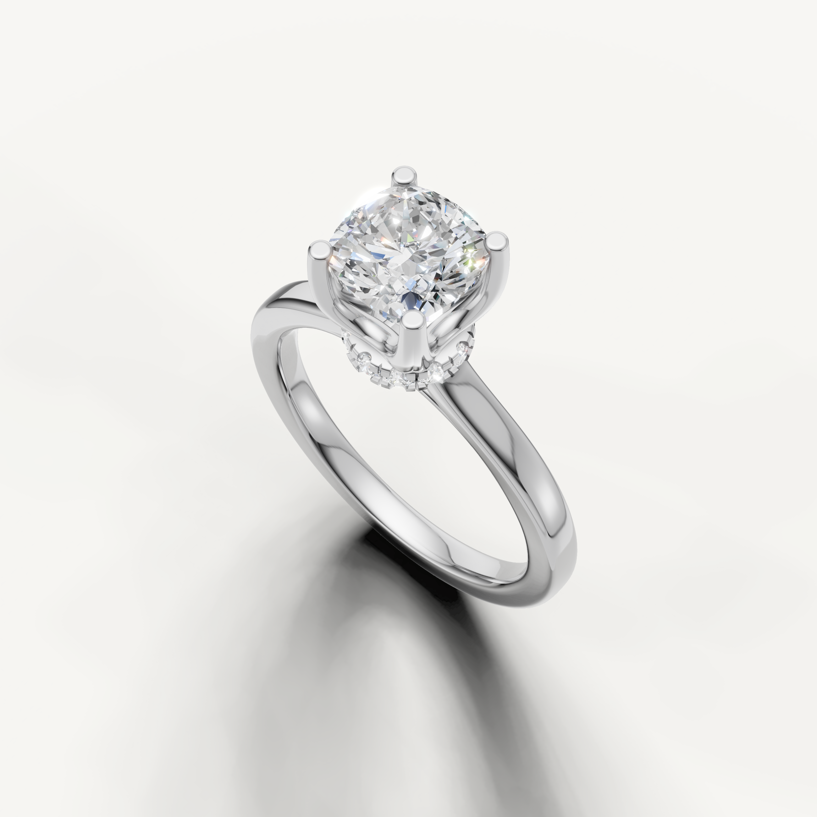A minimalist platinum-tone band holding a sparkling cushion-cut diamond with a clean, sophisticated finish.