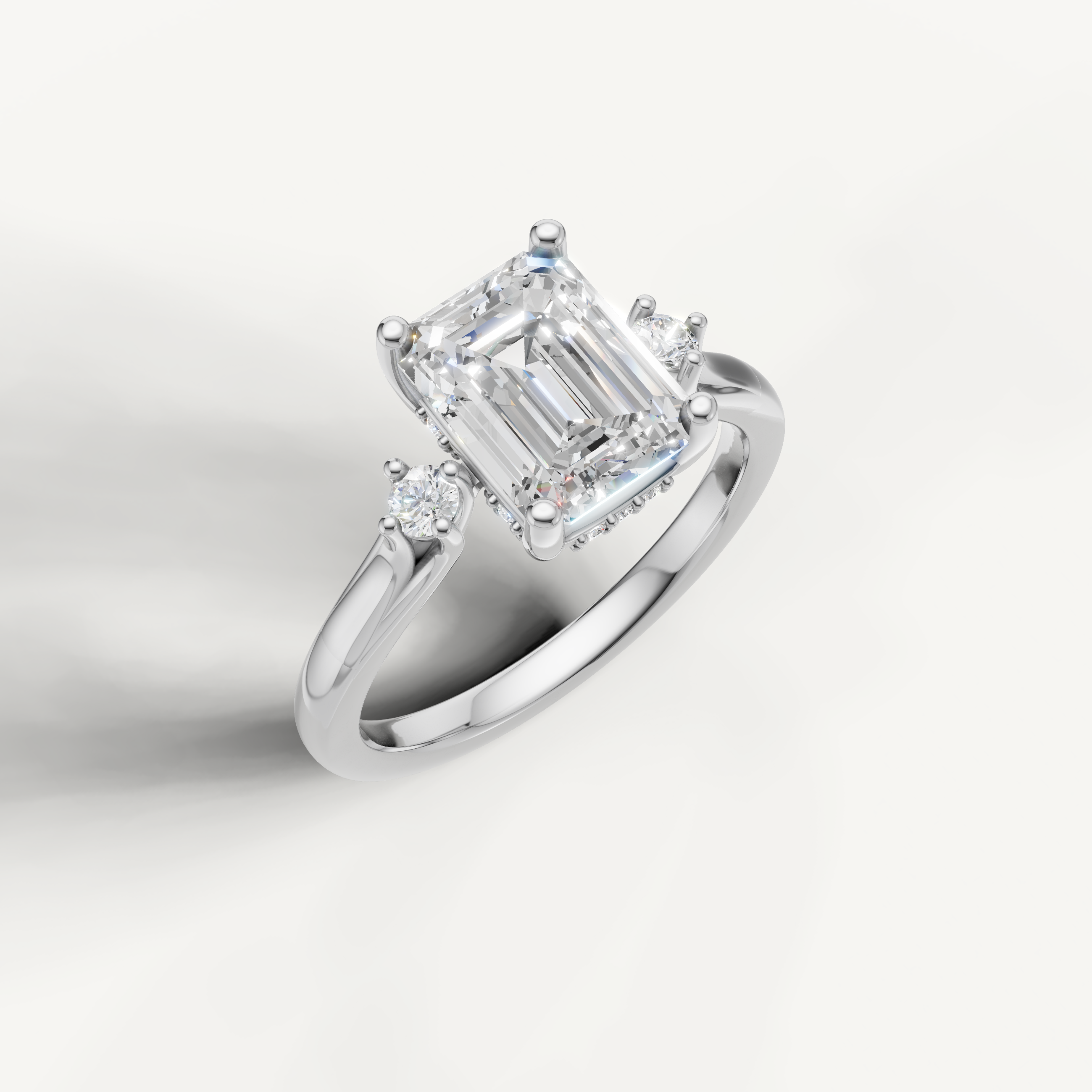 White gold emerald cut diamond ring with classic step cut center stone by Raul Diamonds