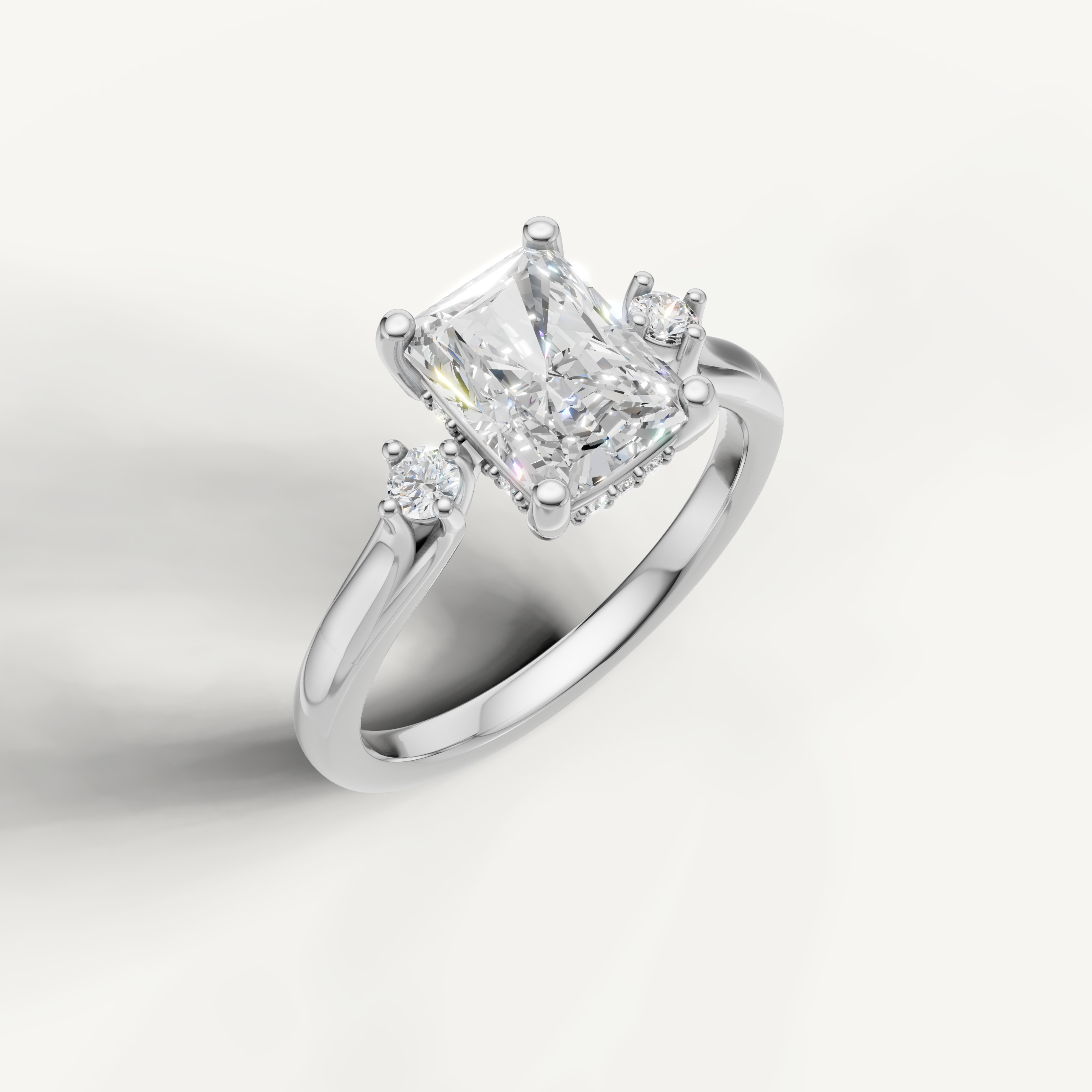 White gold radiant cut diamond ring with elongated center stone and crushed ice brilliance by Raul Diamonds