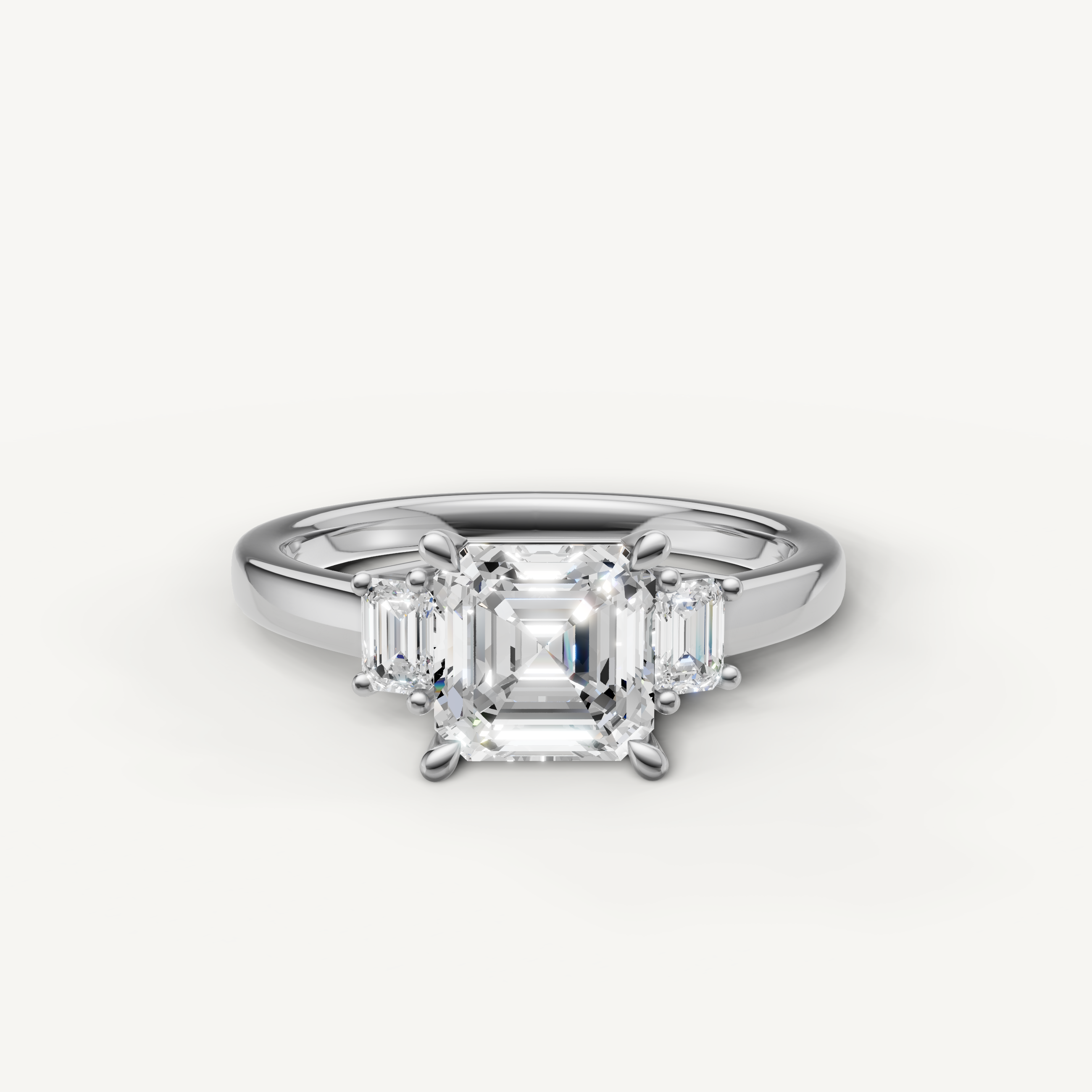 Asscher cut lab grown diamond three stone engagement ring in 14K white gold with trapezoid side stones