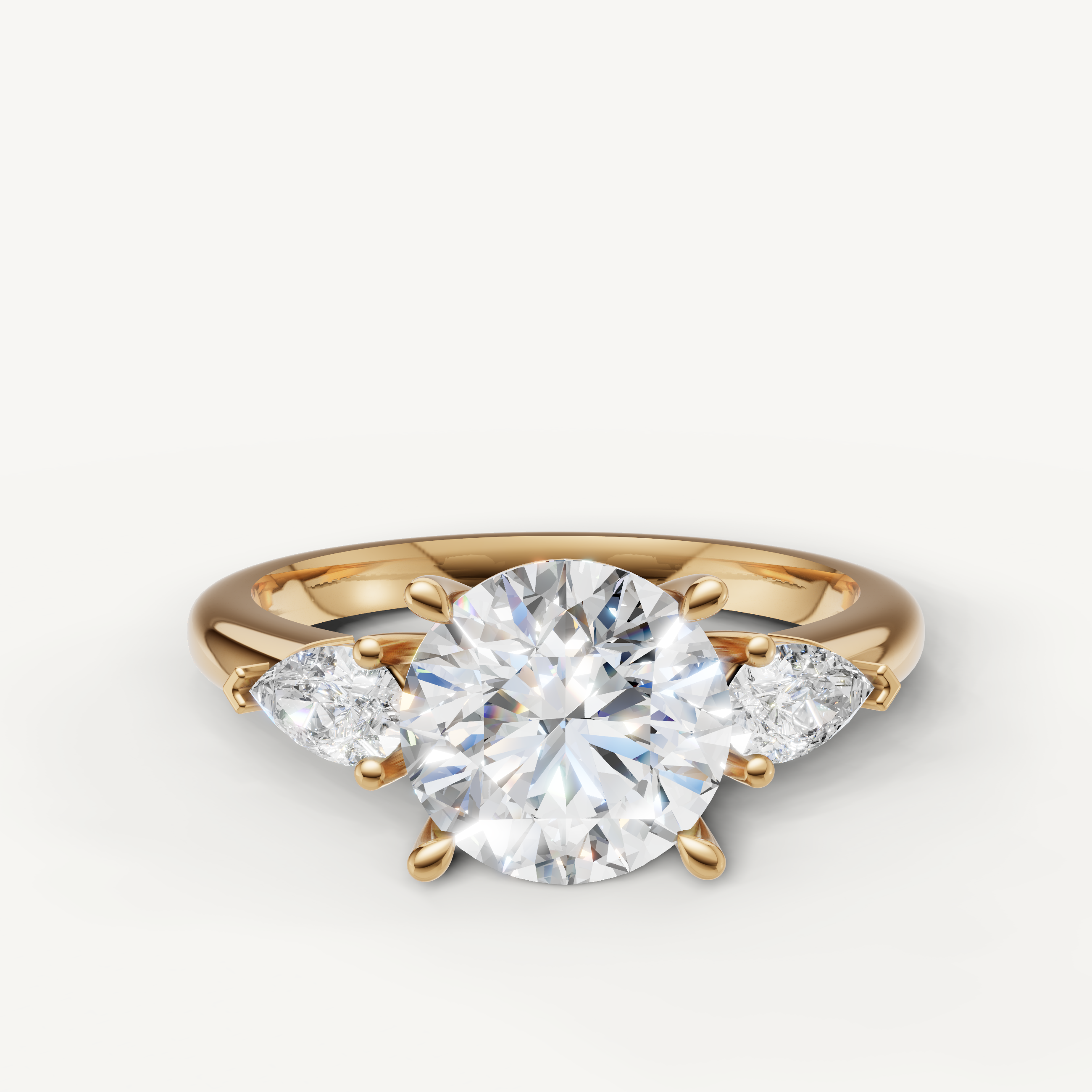 round cut lab grown diamond engagement ring with marquise side stones in 14k yellow gold