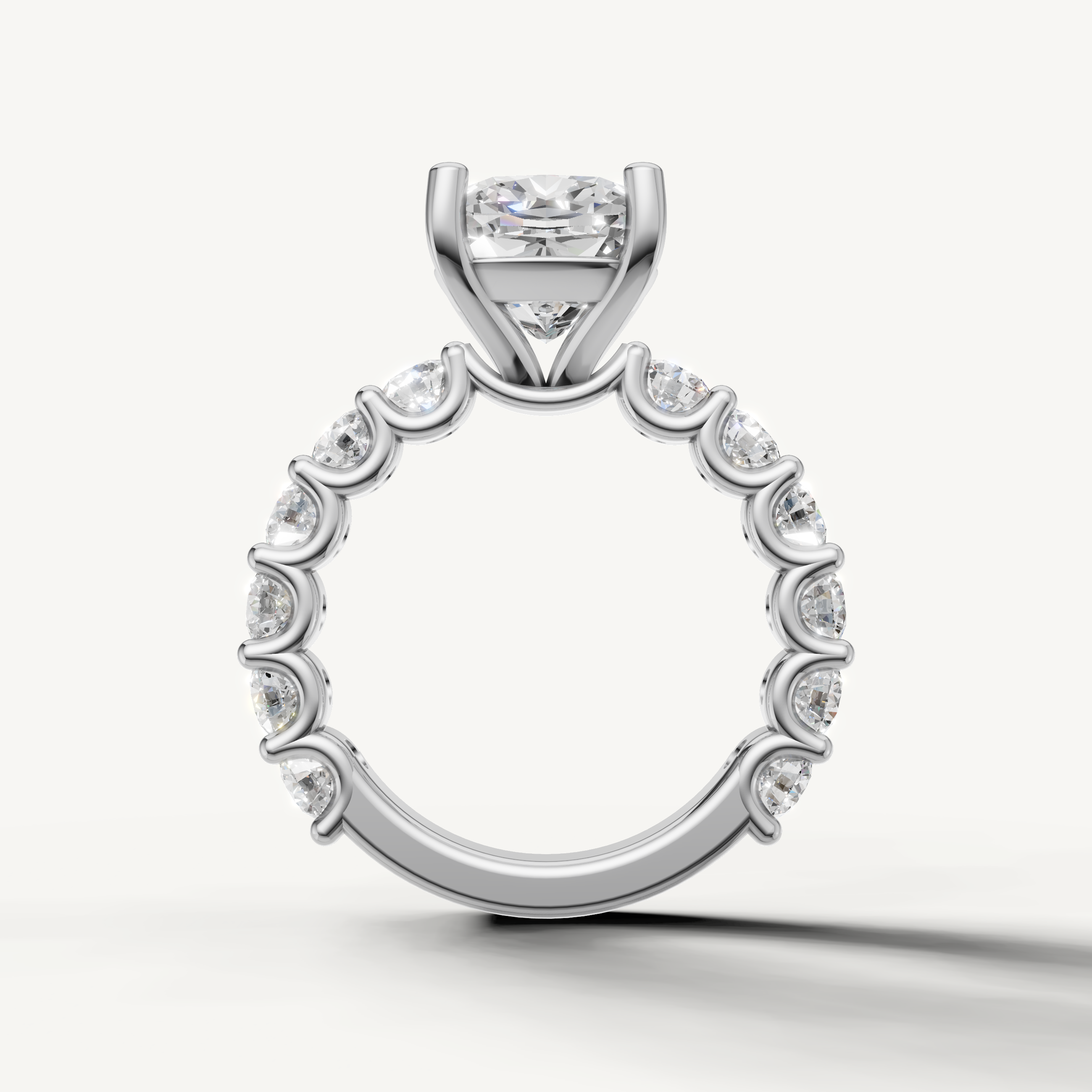 Classic cushion engagement ring with open gallery shared prong band white gold