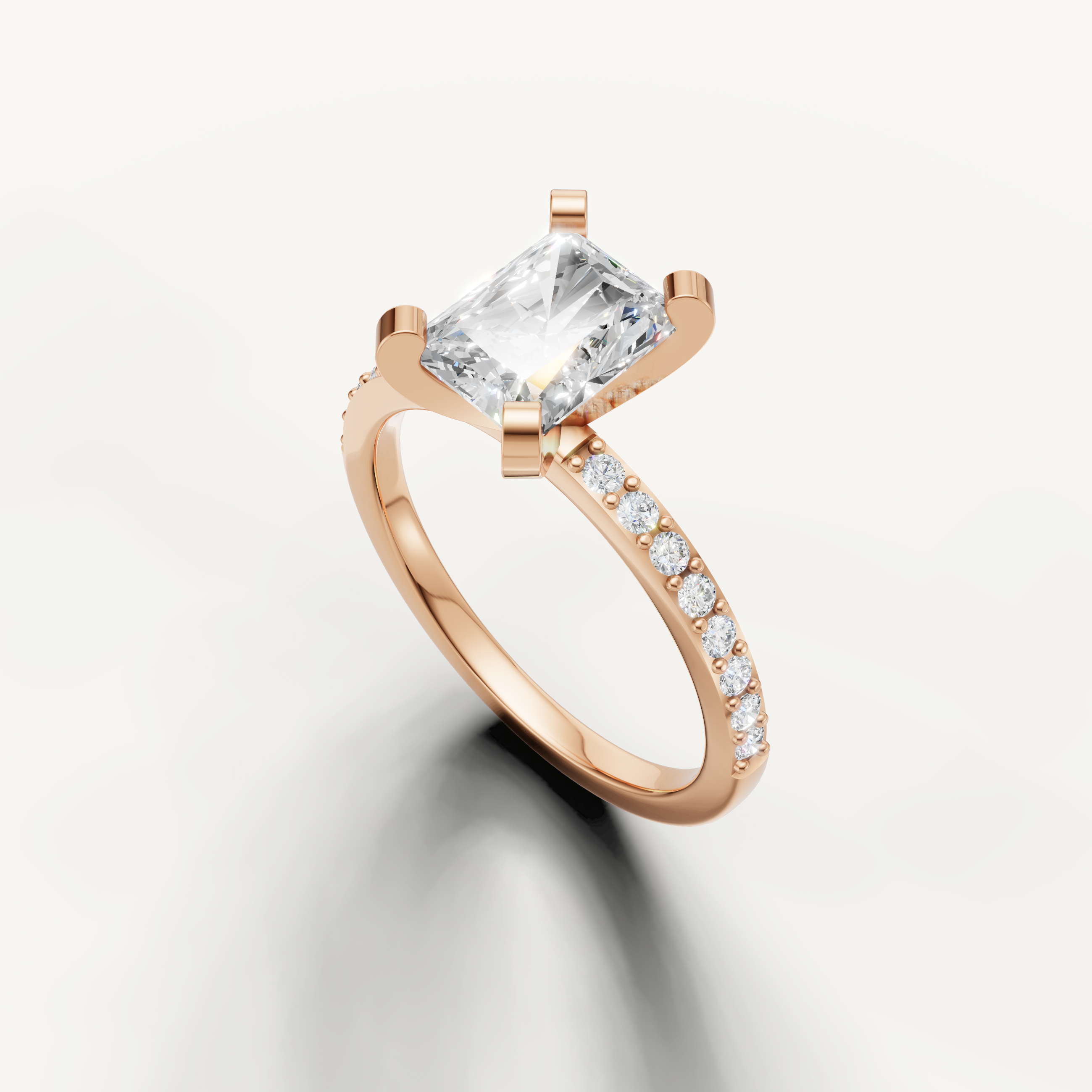 Rectangular radiant cut diamond ring in rose gold micro pavé band