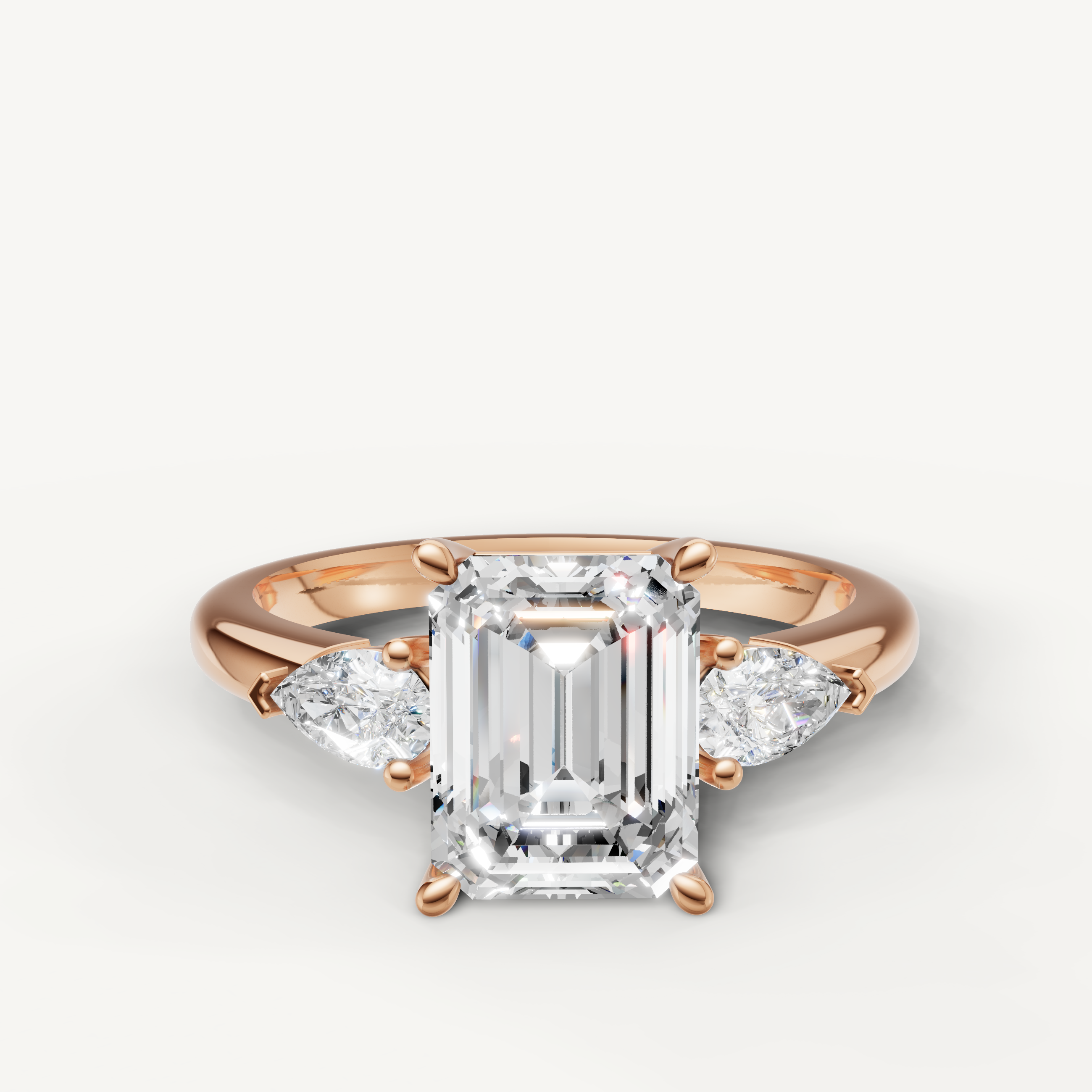 emerald cut lab grown diamond engagement ring with marquise side stones rose gold