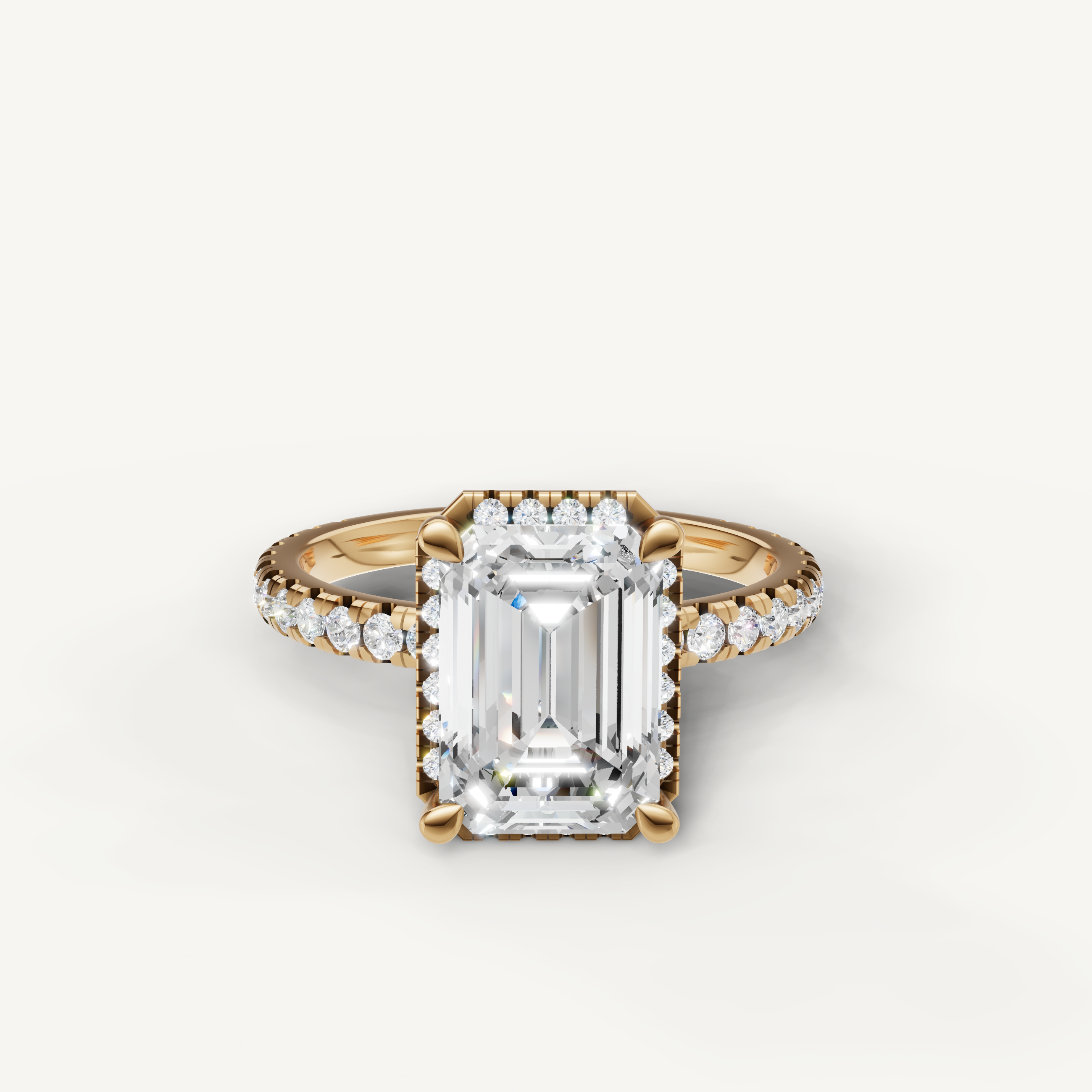 Emerald cut lab grown diamond engagement ring with hidden halo and pavé band yellow gold