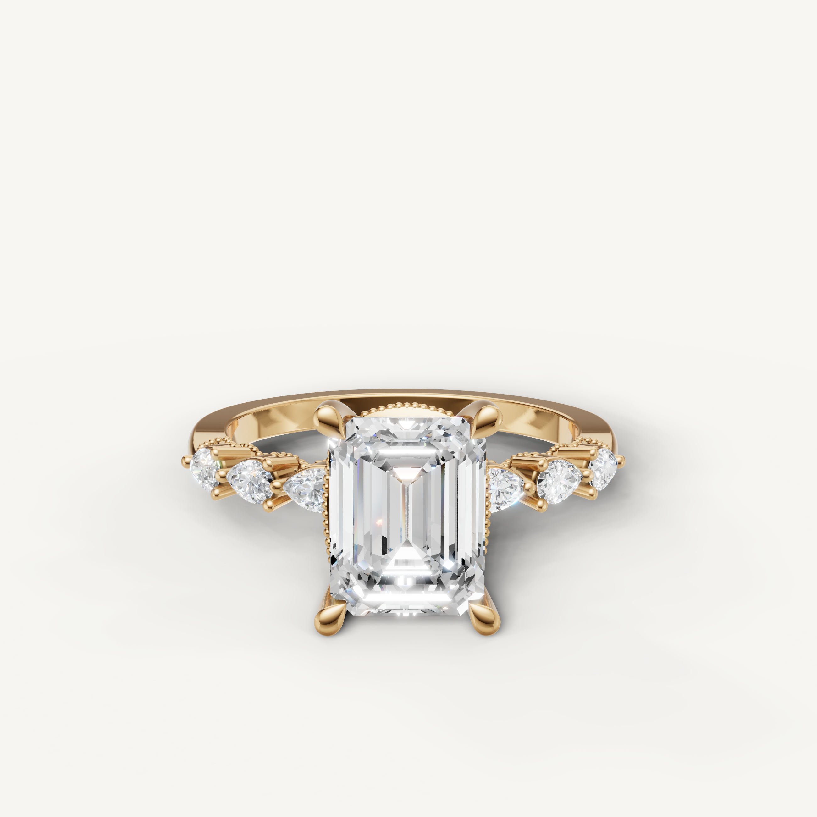emerald cut lab grown diamond engagement ring with marquise and baguette side stones yellow gold