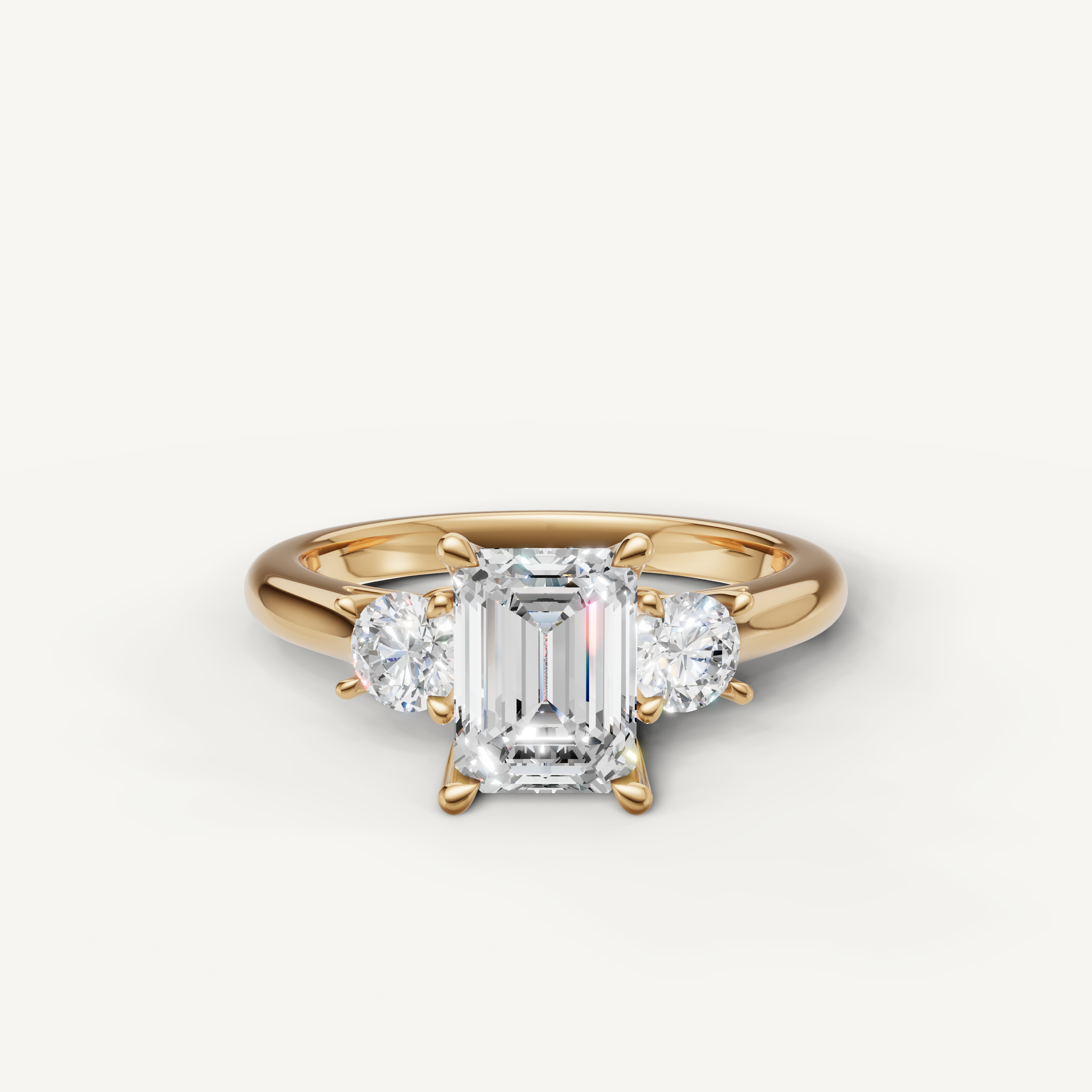 Emerald cut three stone lab grown diamond engagement ring in 14K yellow gold