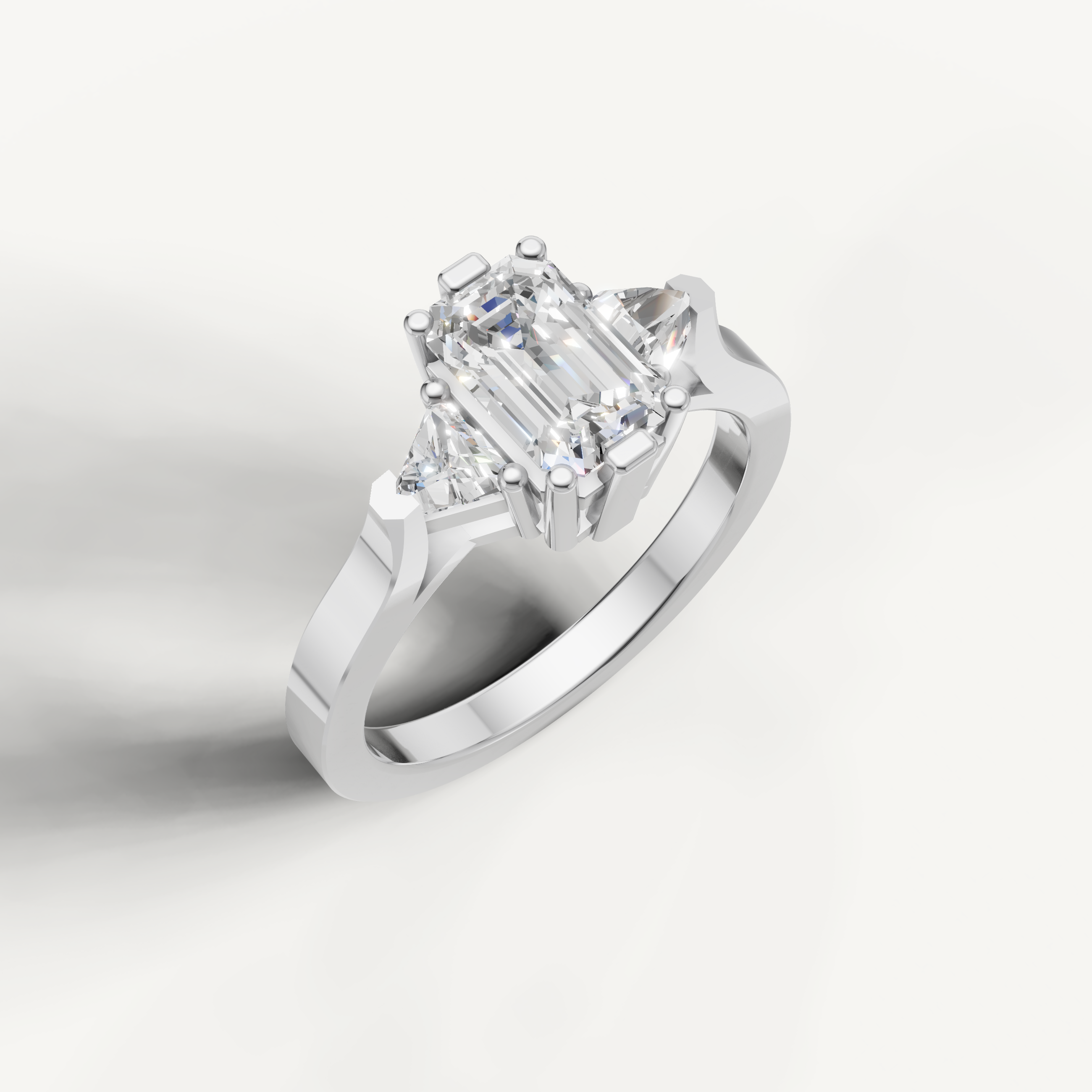 Classic white gold emerald cut diamond ring with modern minimalist setting.
