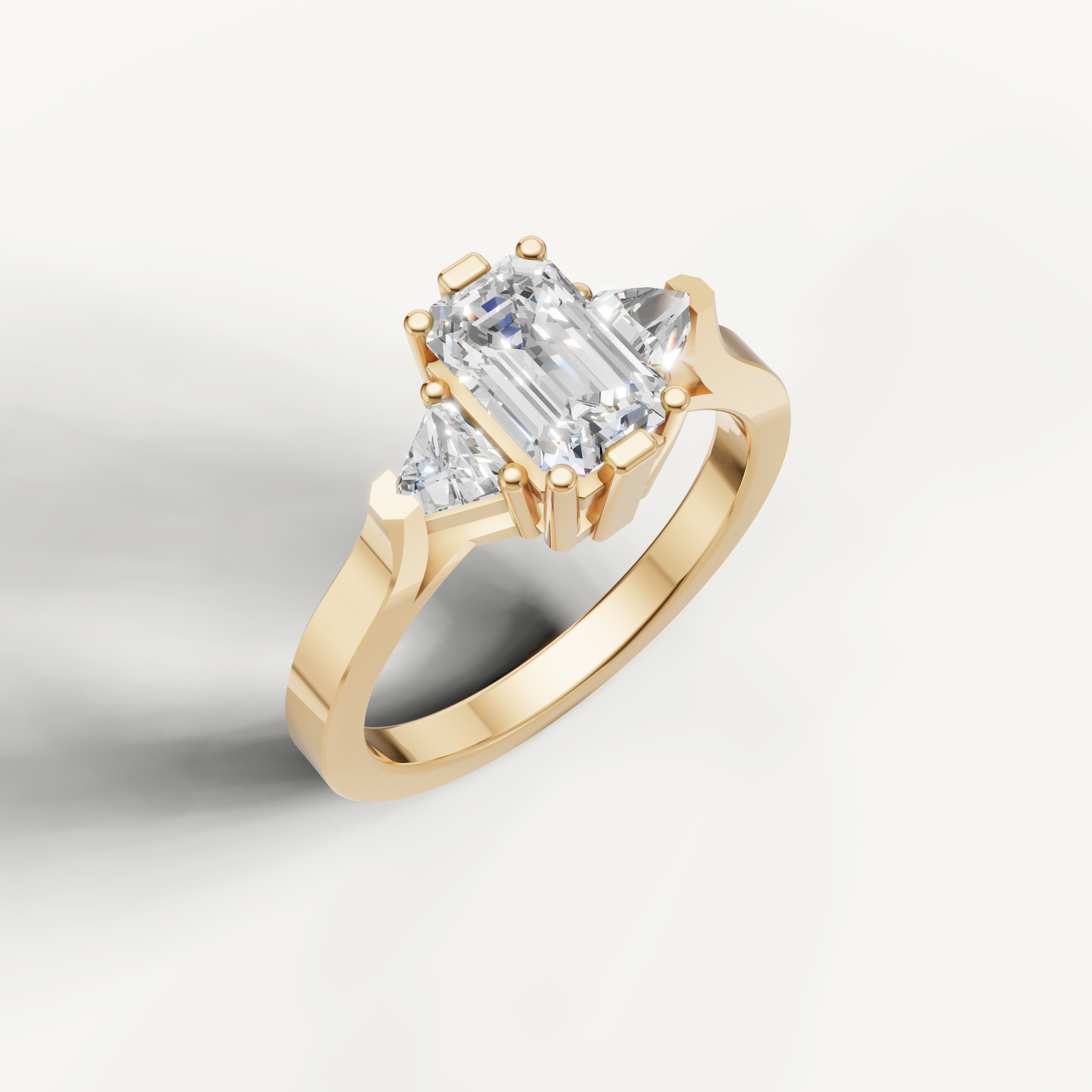 Elegant emerald cut diamond ring with modern three stone setting by Raul Diamonds.