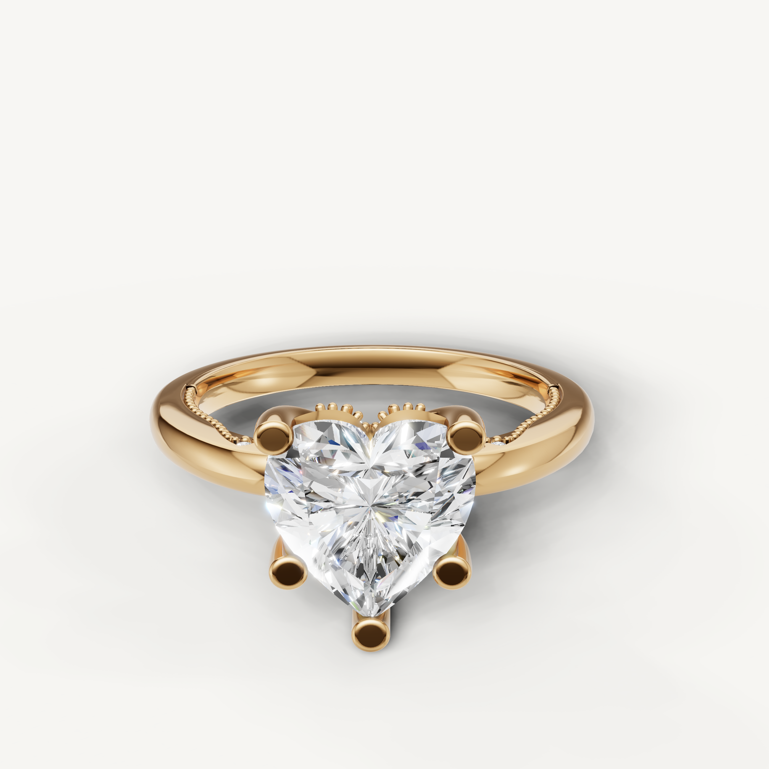 A romantic solitaire engagement ring in polished 14k yellow gold, featuring a brilliant heart-shaped diamond held by a secure multi-prong setting.