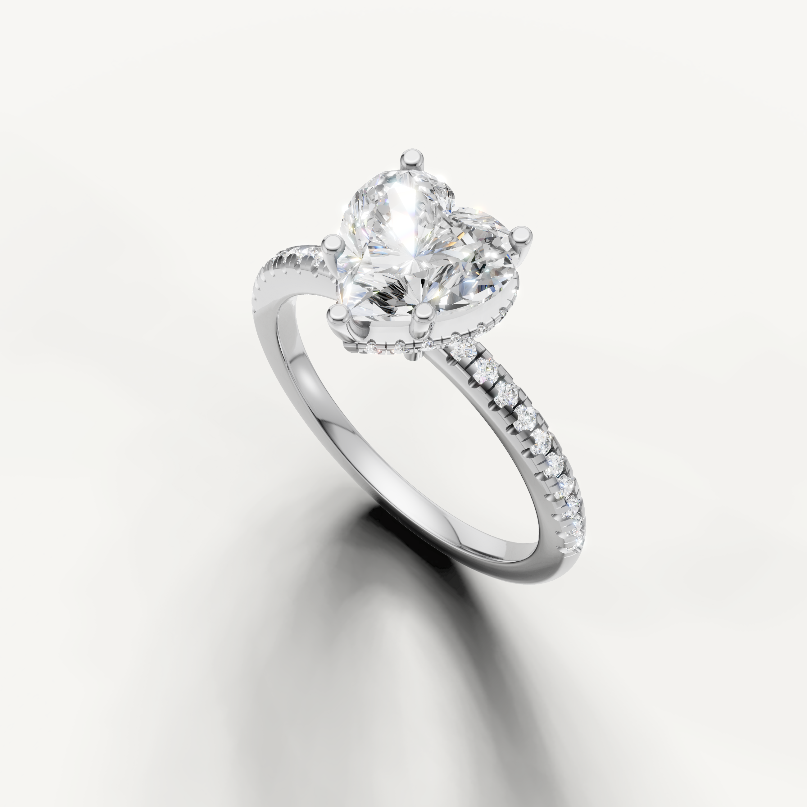 heart shaped diamond engagement ring with delicate pavé band and hidden halo white gold