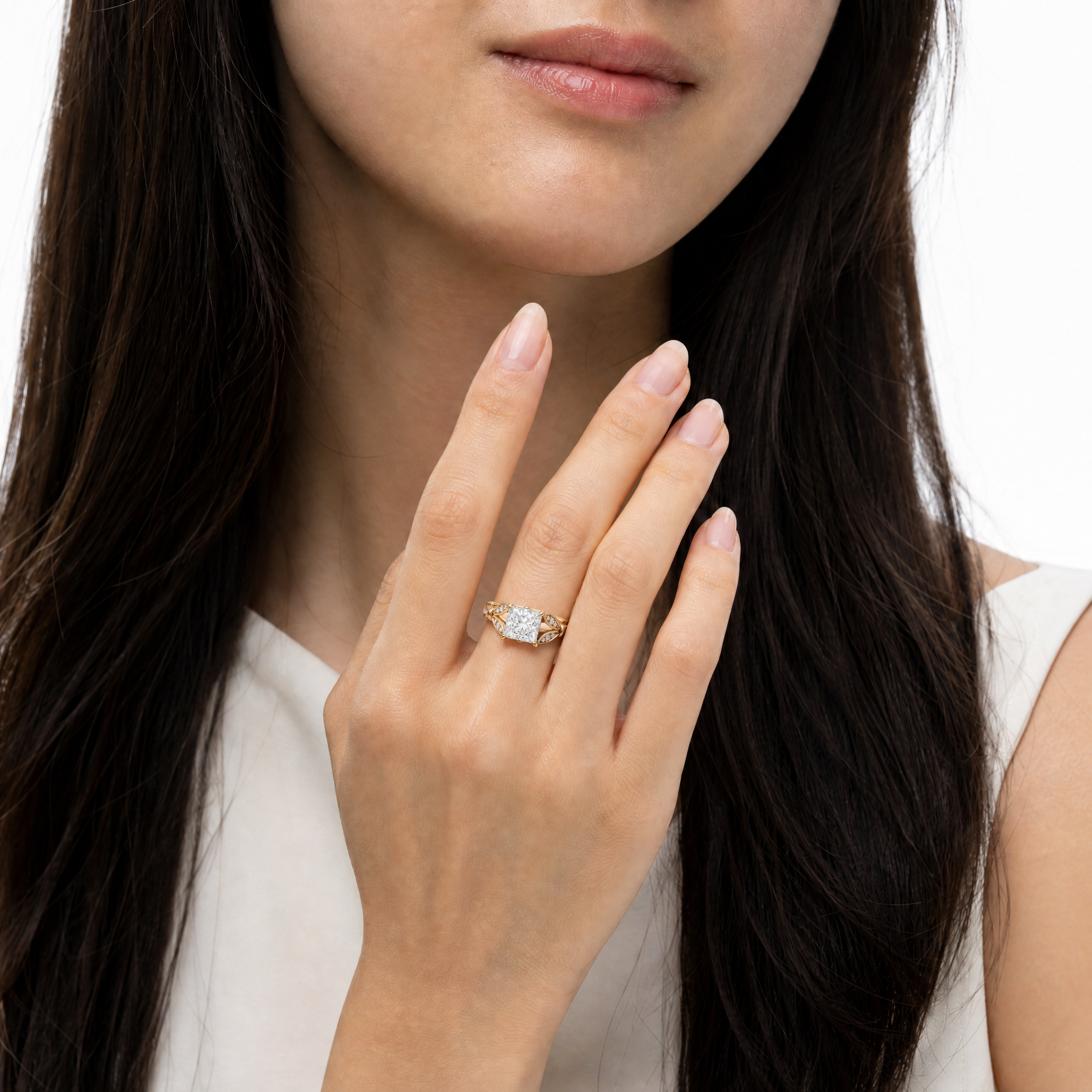 Model wearing Raul Diamonds princess cut lab grown diamond engagement ring in 14K gold with elegant pavé detailing