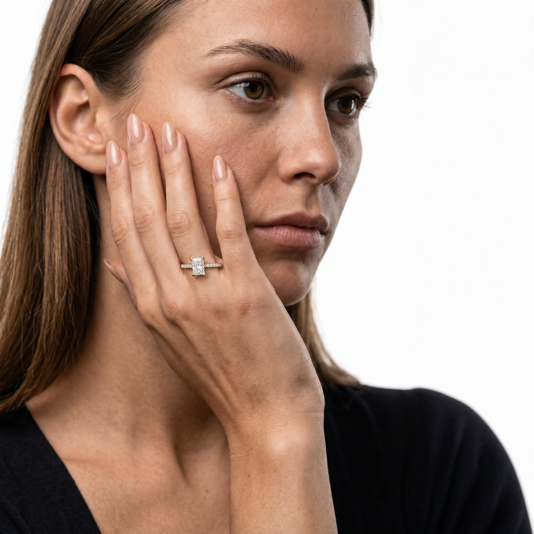 Model wearing a radiant cut lab grown diamond pavé engagement ring in 14K gold by Raul Diamonds
