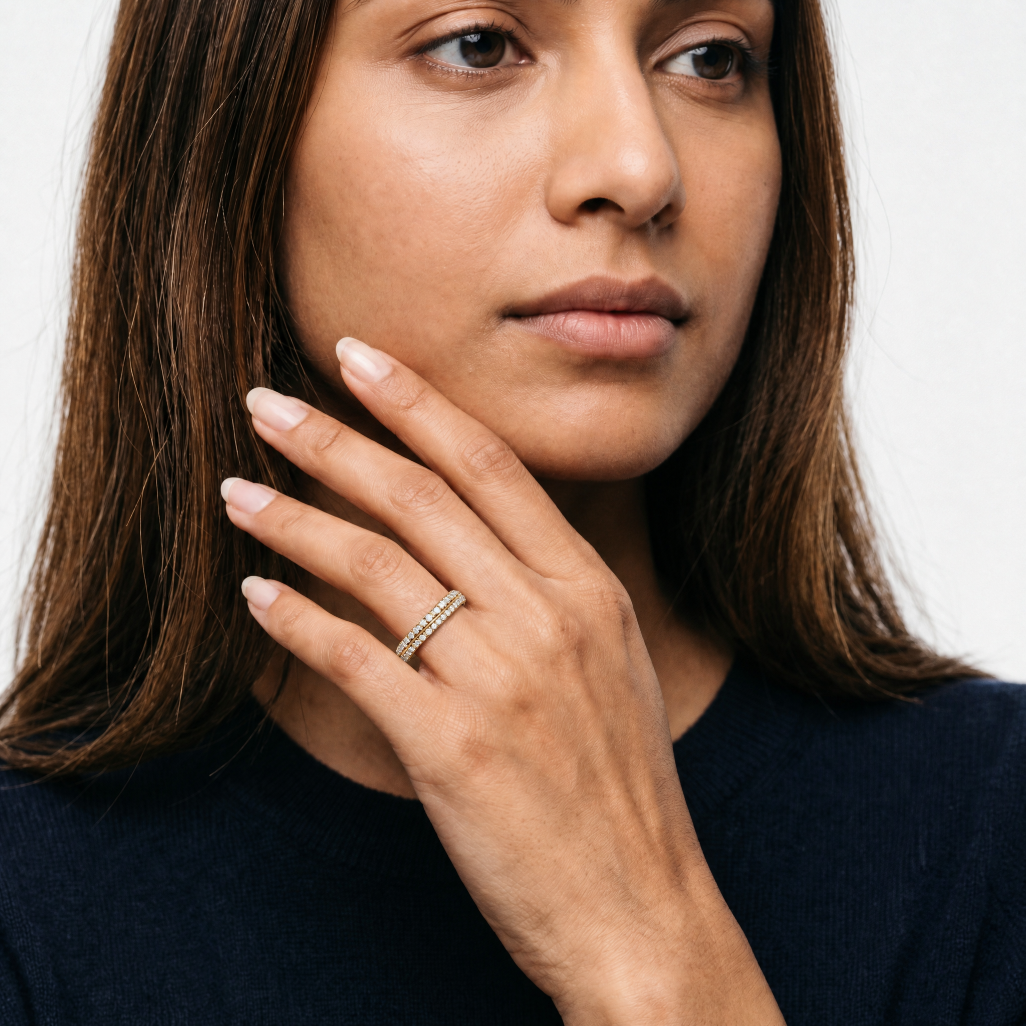 Model wearing round lab grown diamond pavé wedding band in 14K gold by Raul Diamonds