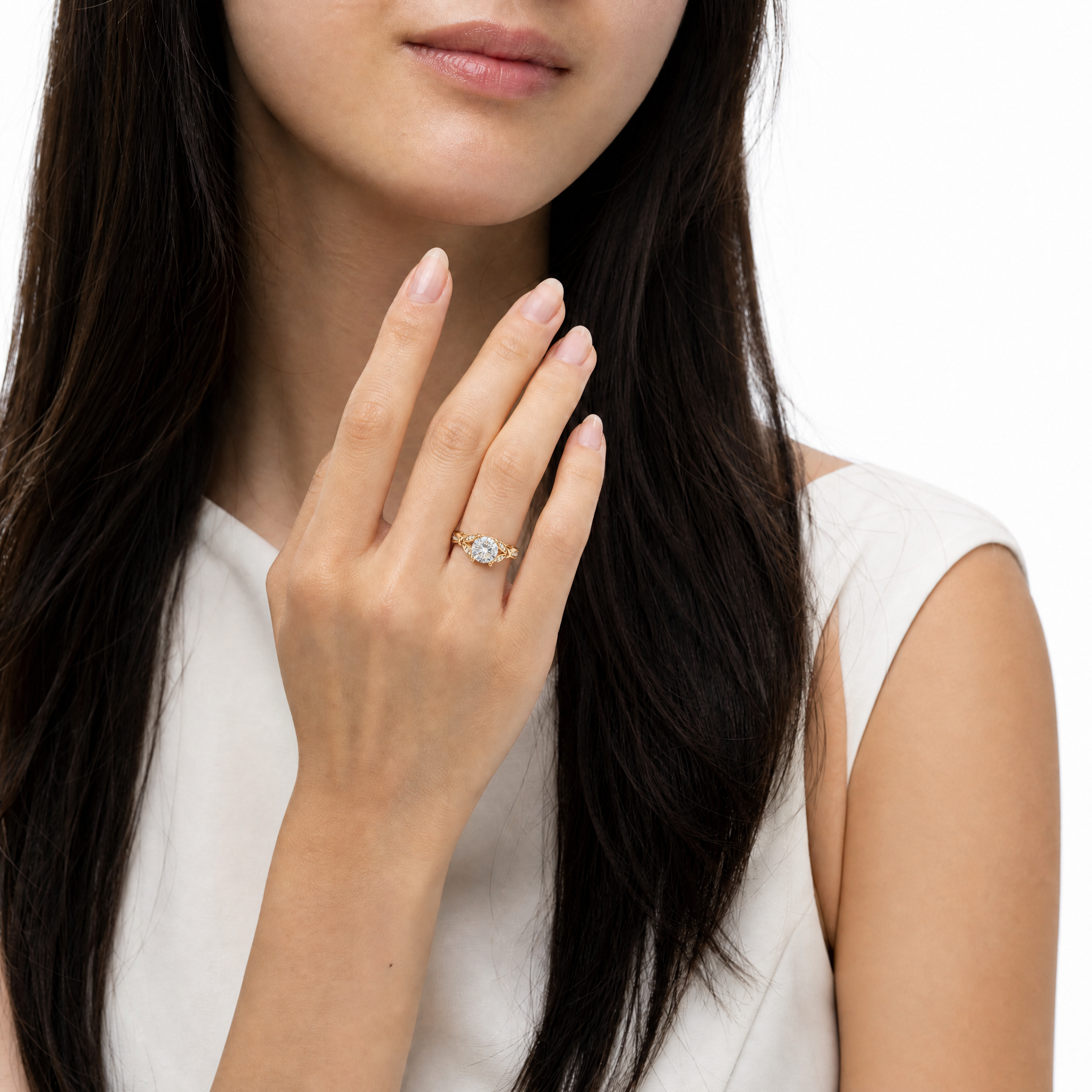 Model wearing Raul Diamonds round cut lab grown diamond engagement ring in 14K gold with elegant pavé detailing