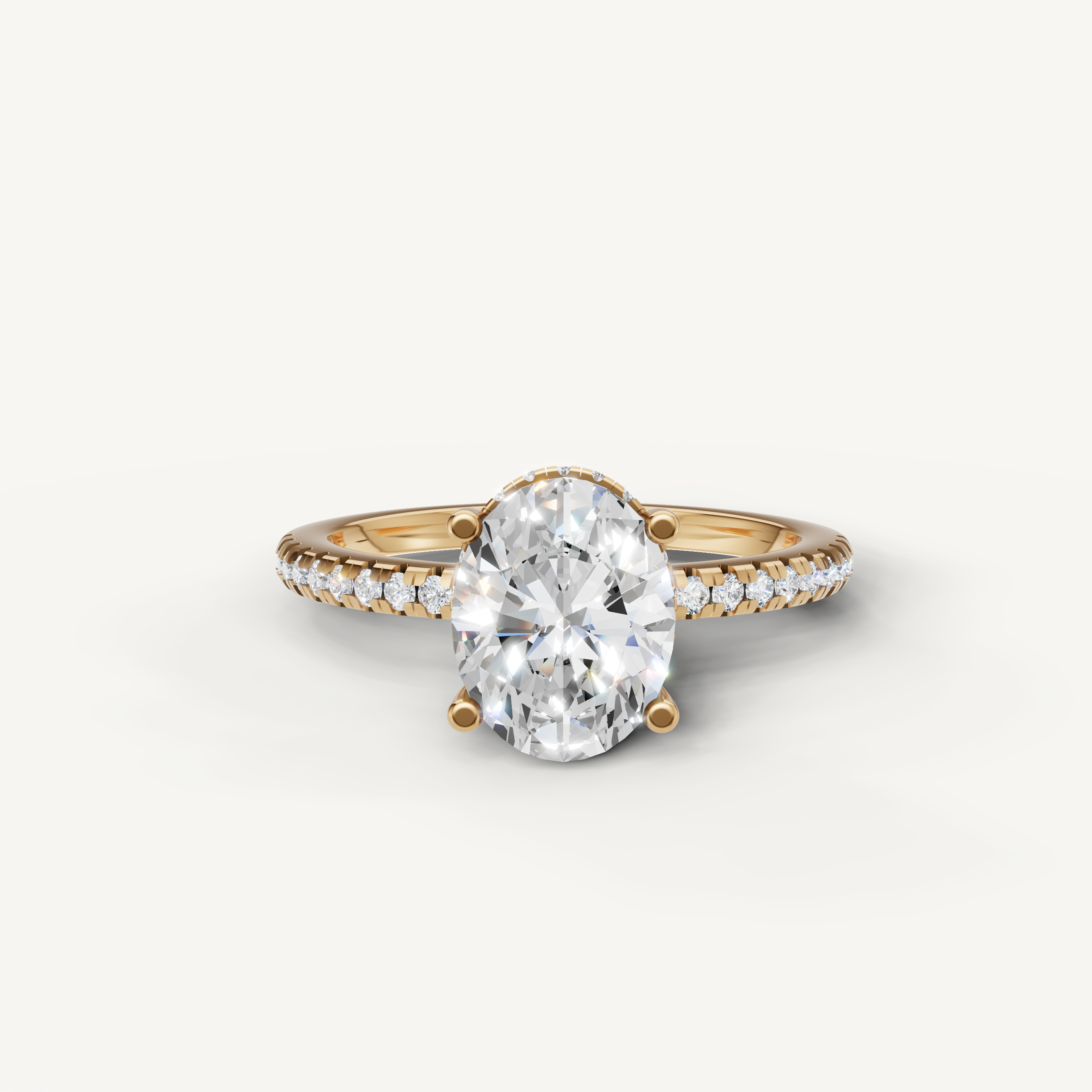 oval cut lab grown diamond engagement ring with pavé band in 14k yellow gold