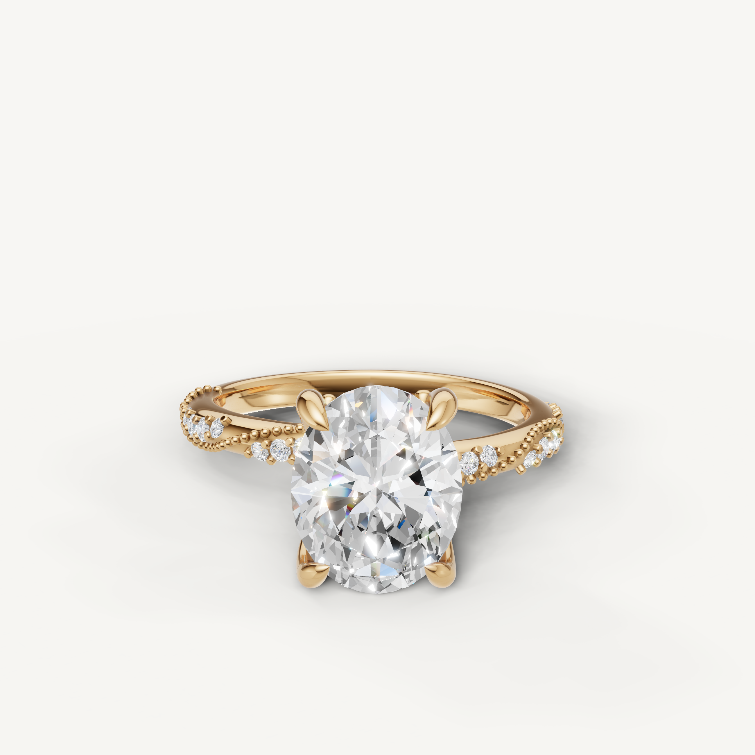 oval cut lab grown diamond engagement ring with twisted pavé band yellow gold