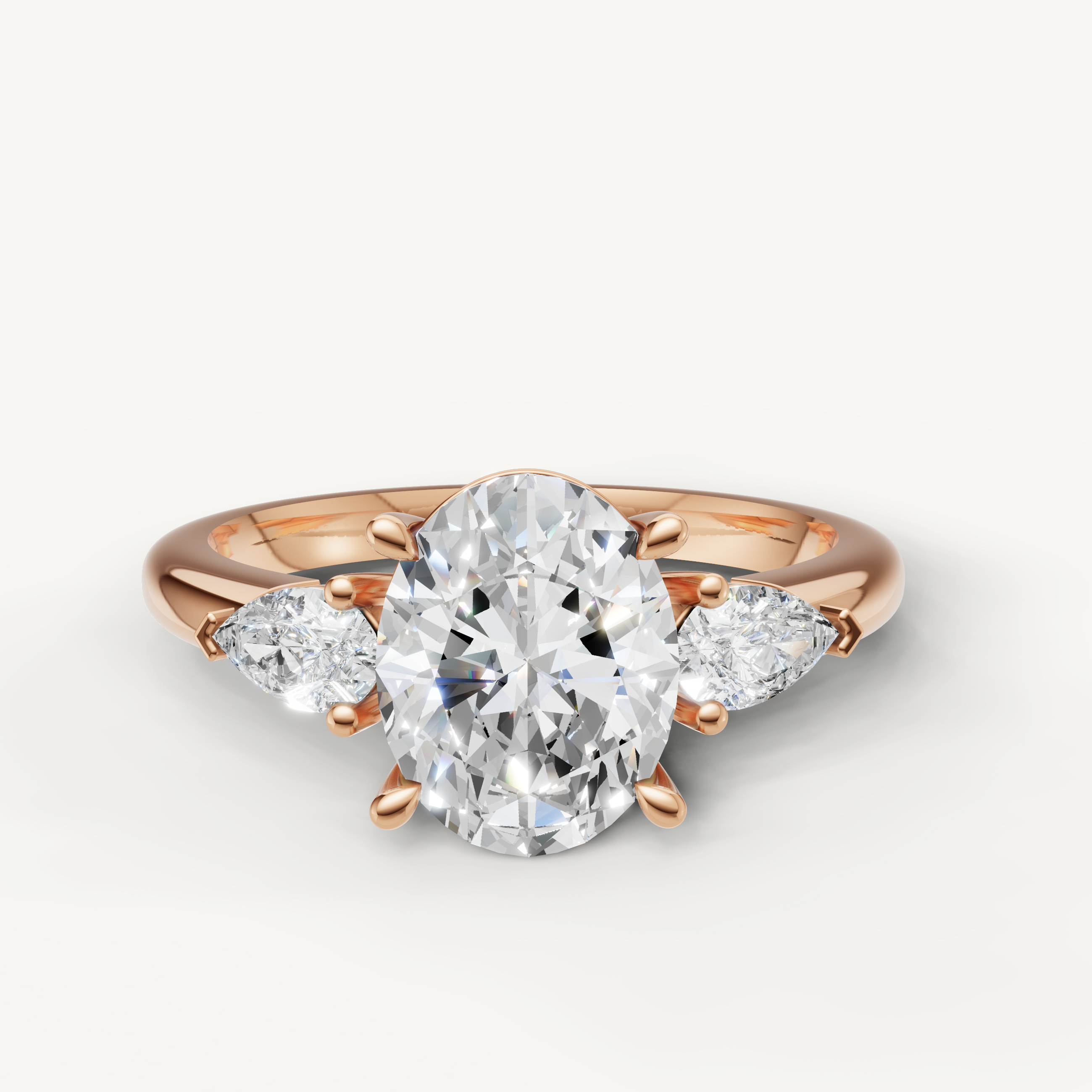 oval lab grown diamond engagement ring with marquise side stones in 14k rose gold