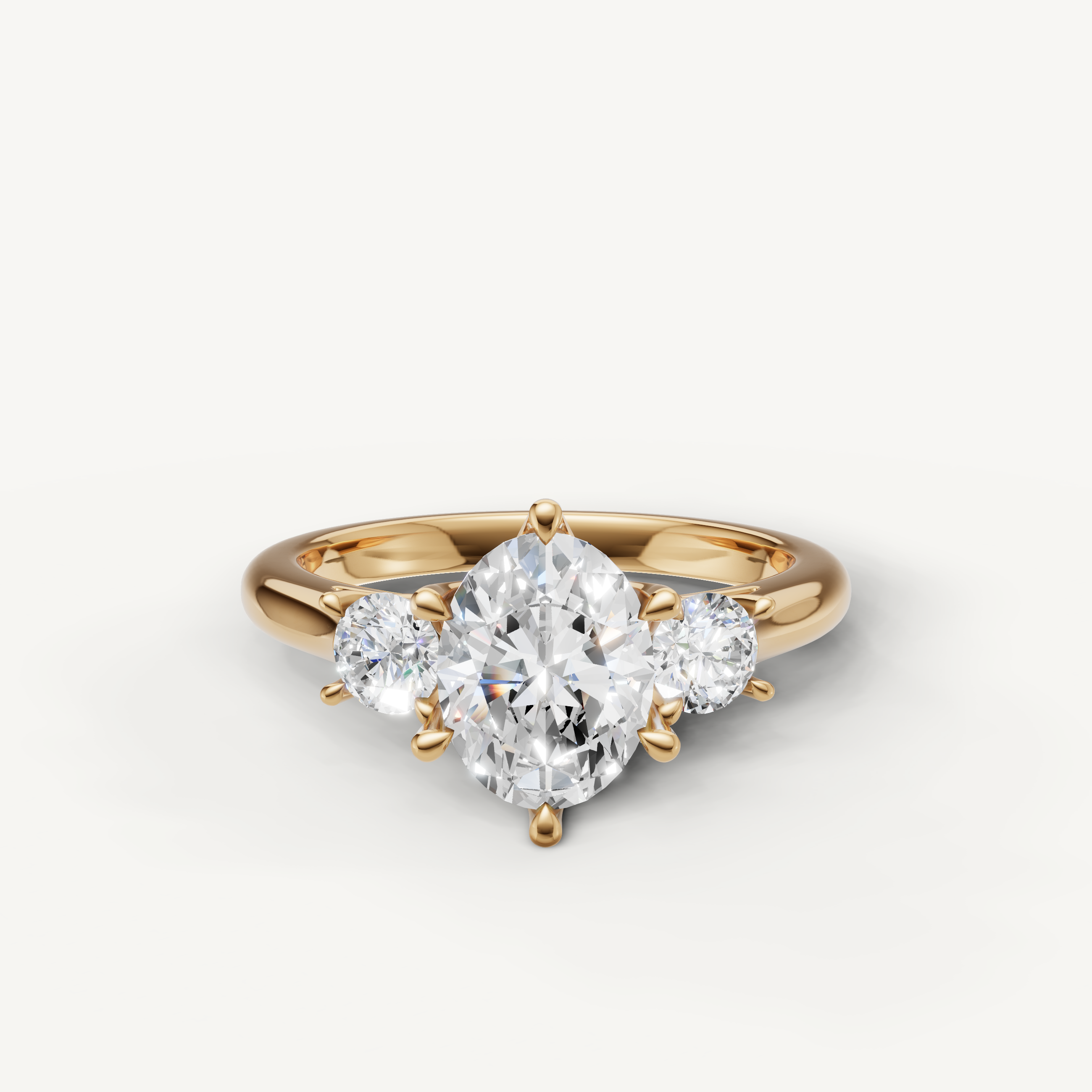 Oval cut three stone lab grown diamond engagement ring in 14K yellow gold