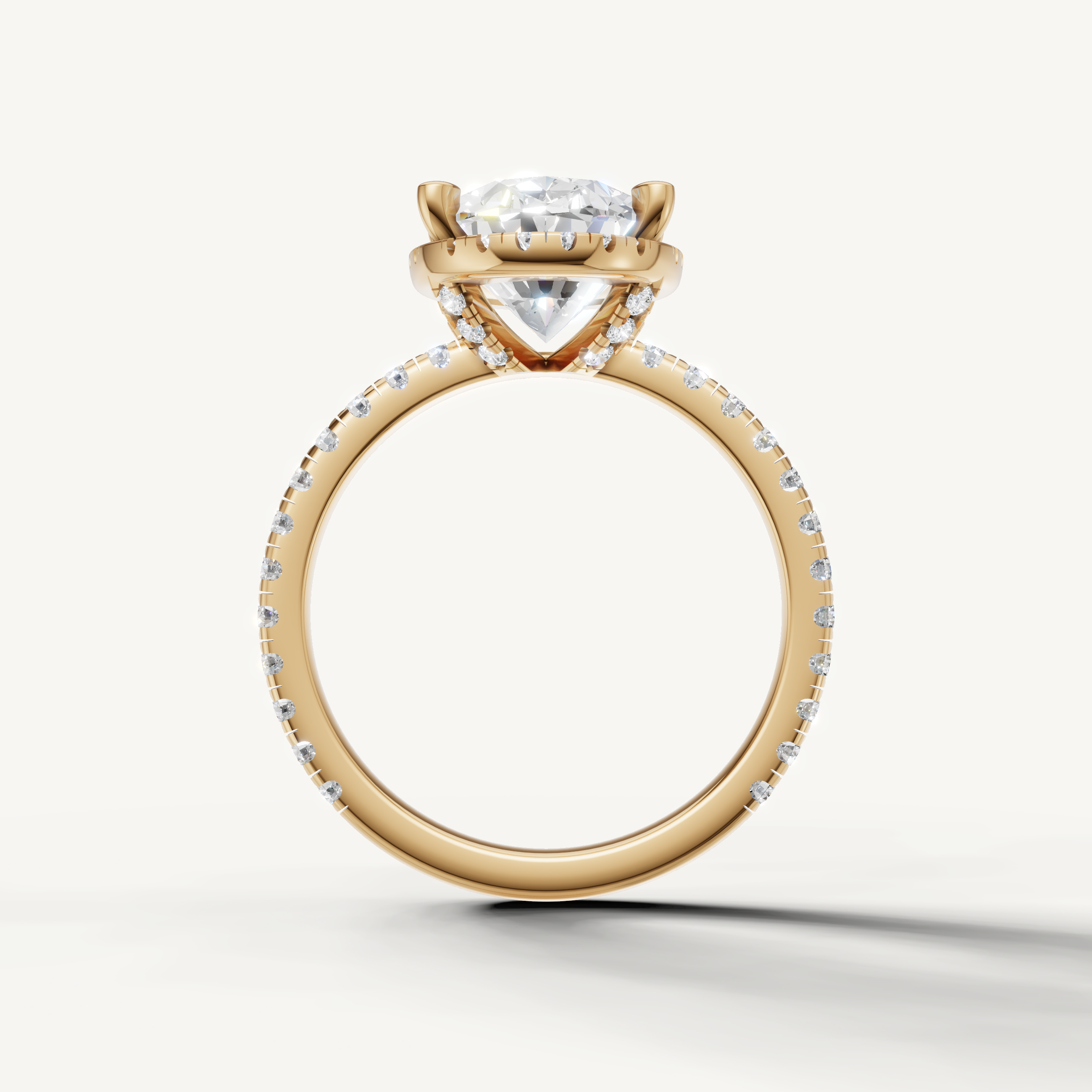 Oval shape engagement ring with pavé band and hidden halo yellow gold timeless style