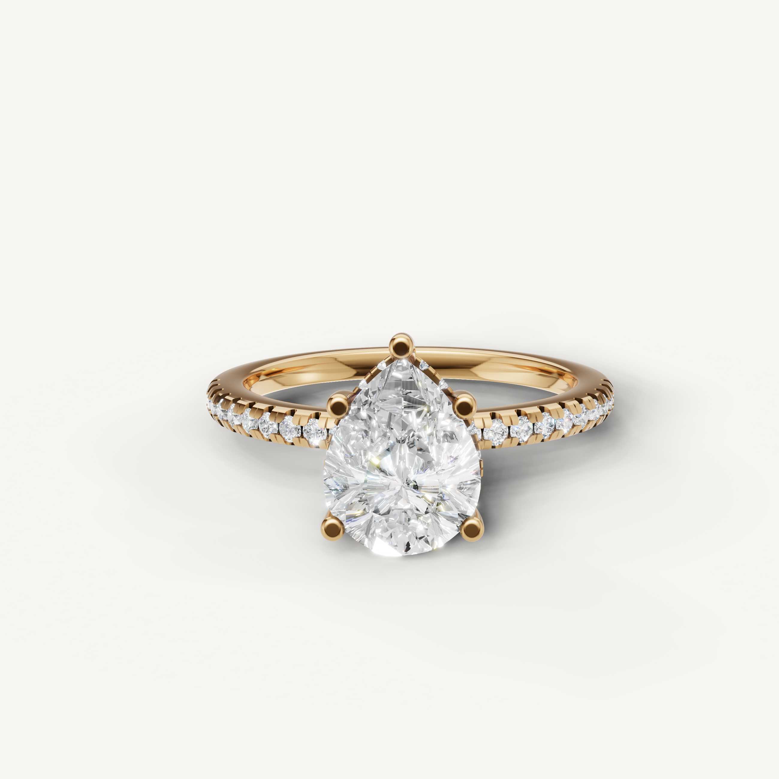 pear cut lab grown diamond engagement ring with pavé band in 14k yellow gold