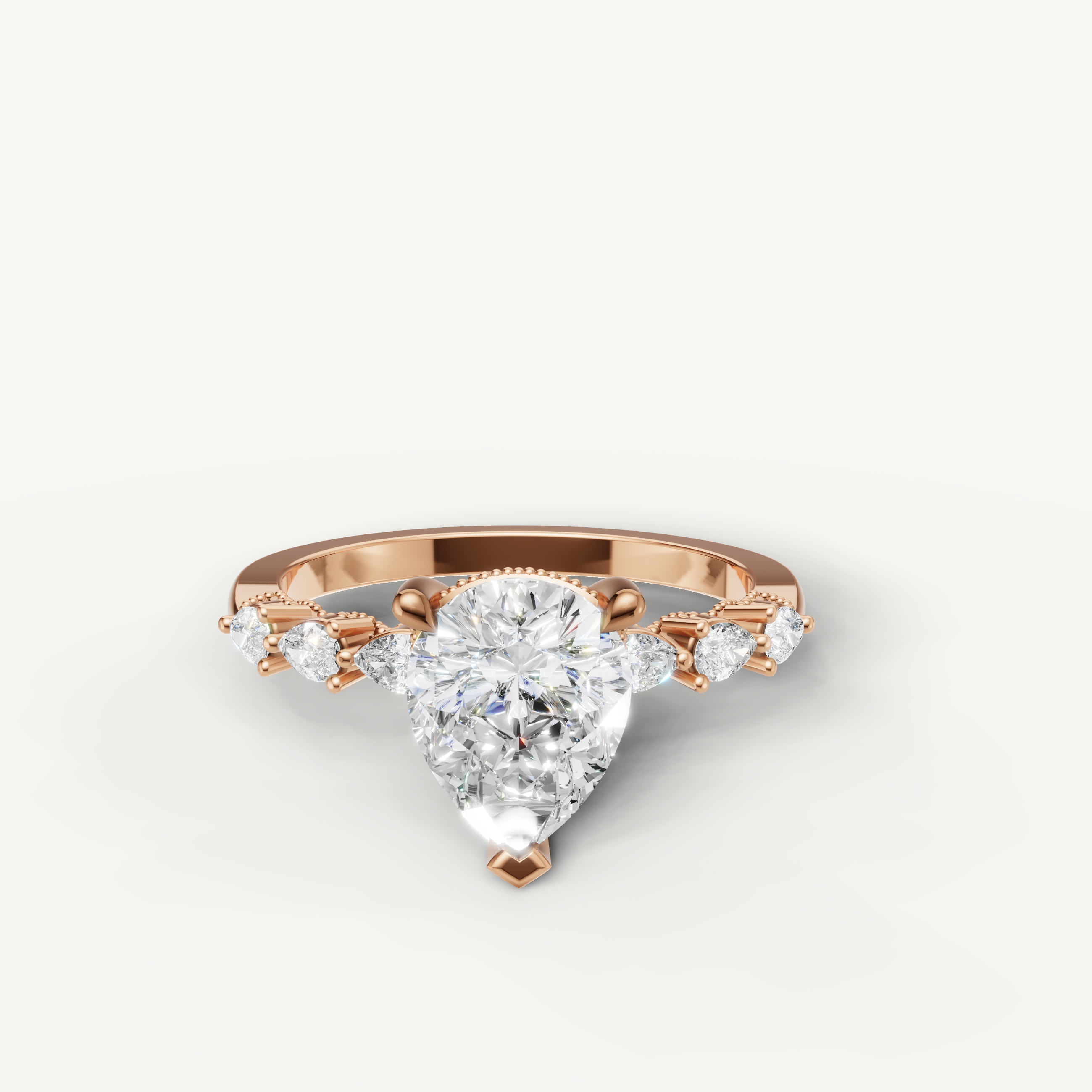 Pear cut lab grown diamond engagement ring in 14K rose gold with marquise side stones by Raul Diamonds