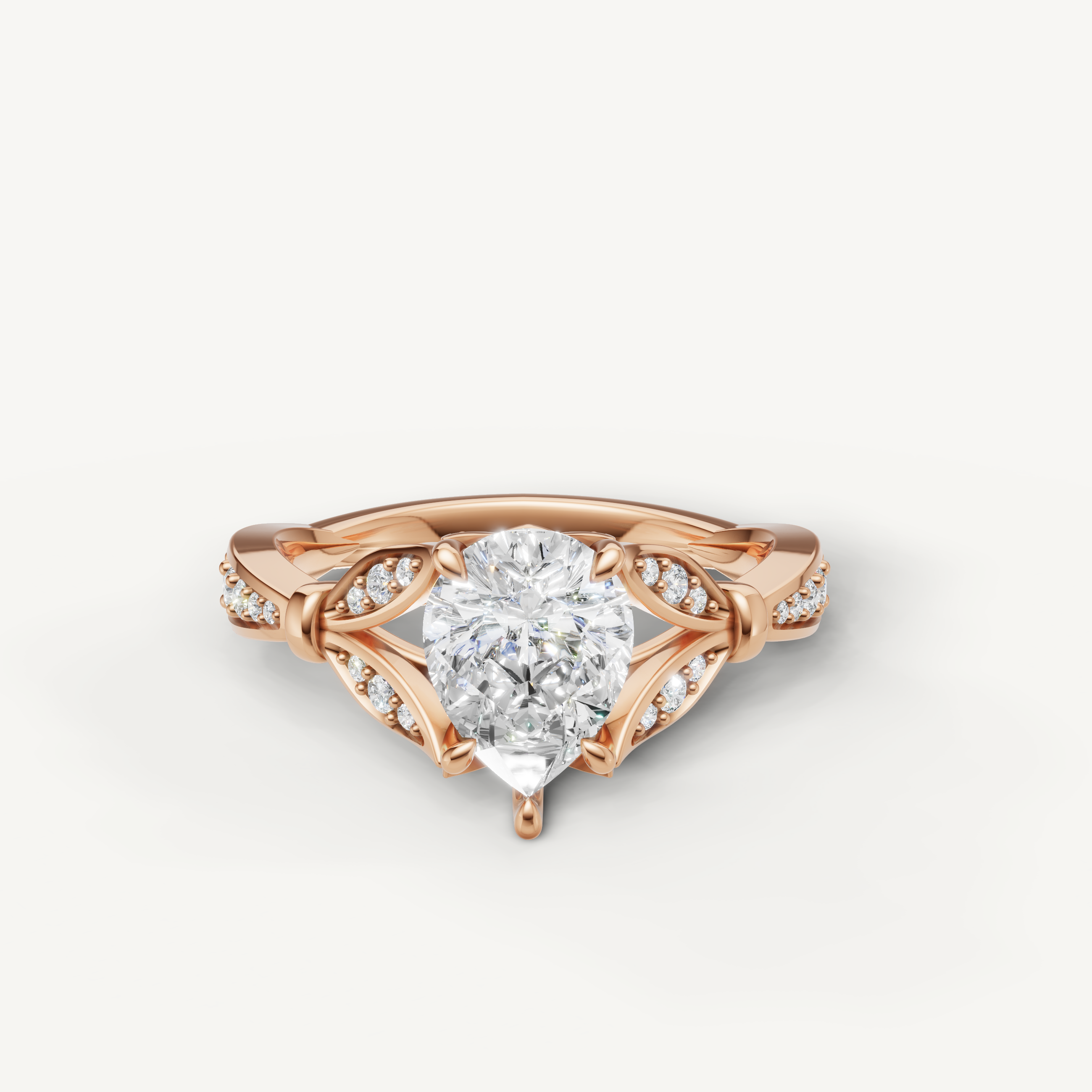 Pear cut lab grown diamond engagement ring in 14K rose gold with elegant pavé detailing by Raul Diamonds