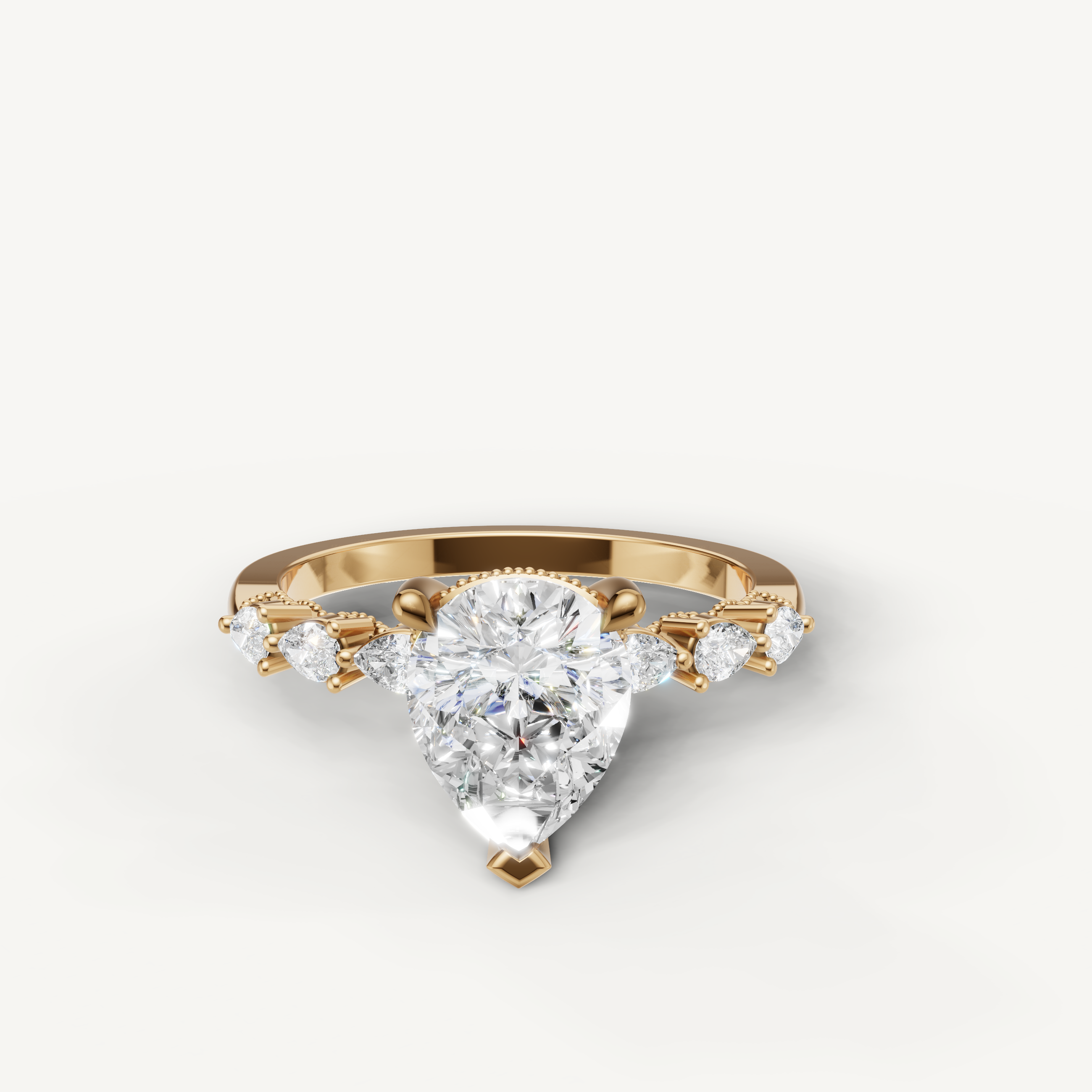 Pear cut lab grown diamond engagement ring in 14K yellow gold with marquise side stones by Raul Diamonds